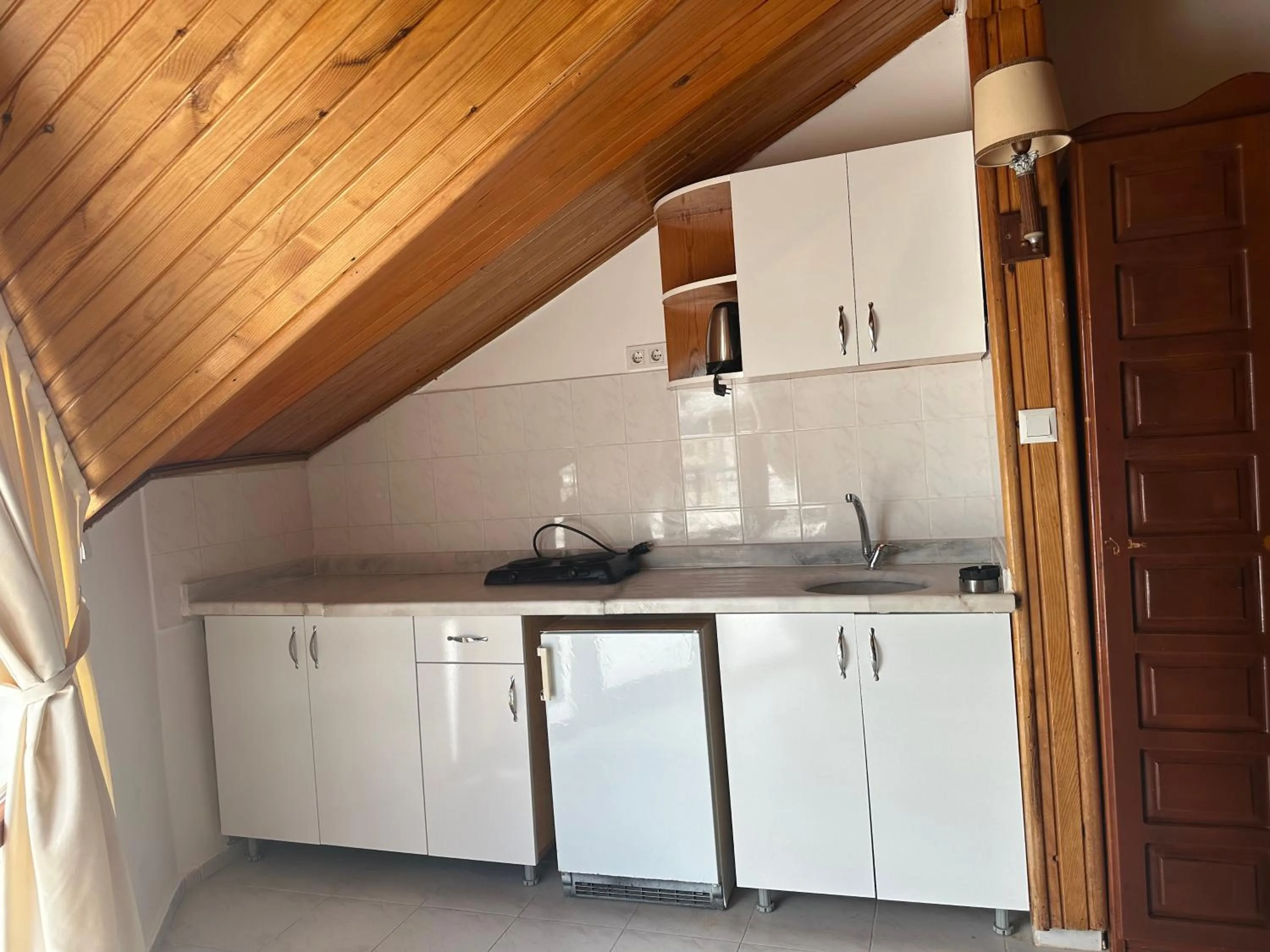 Kitchen or kitchenette in NATURELLA APART HOTEL