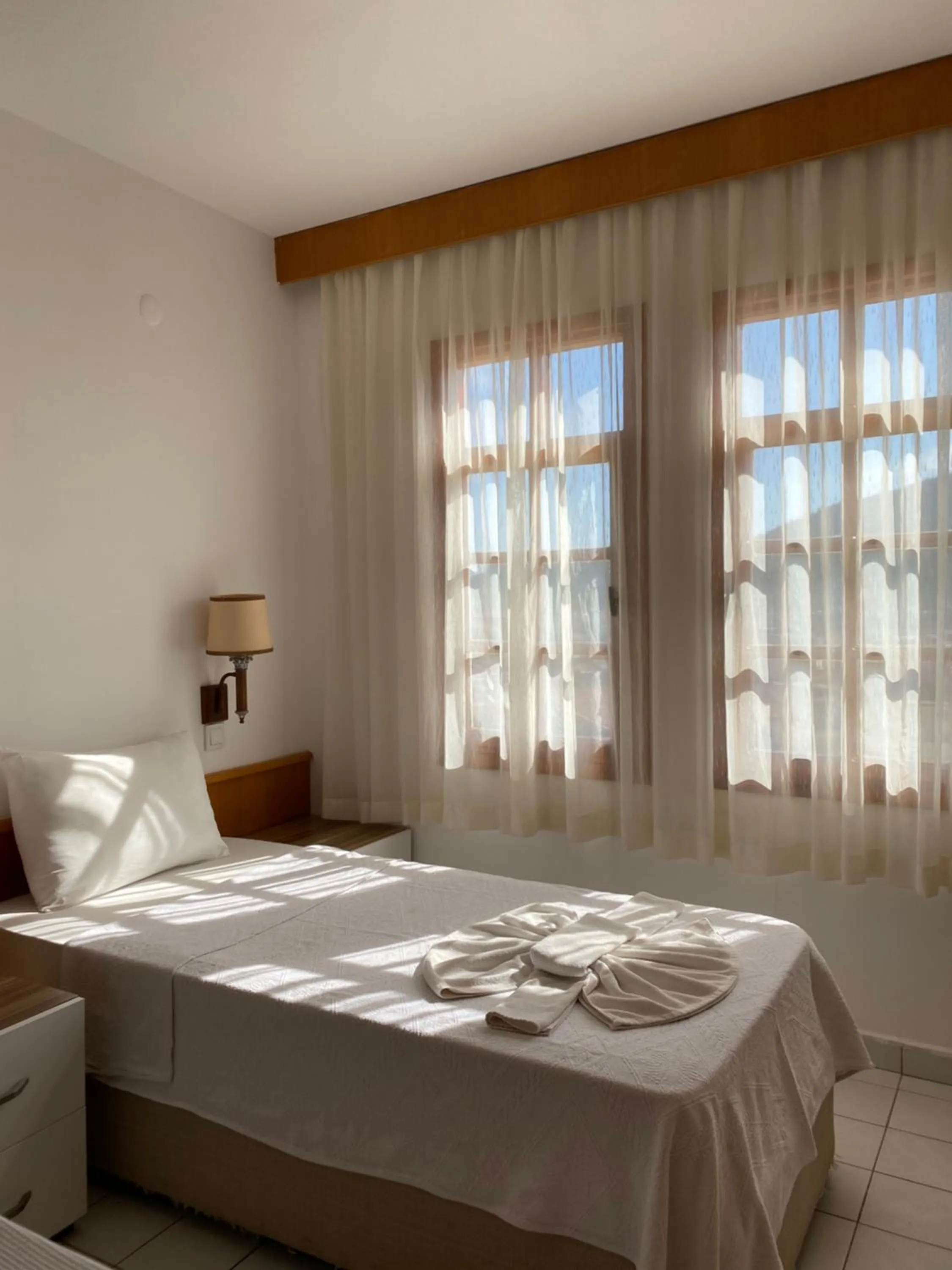 Bed in NATURELLA APART HOTEL