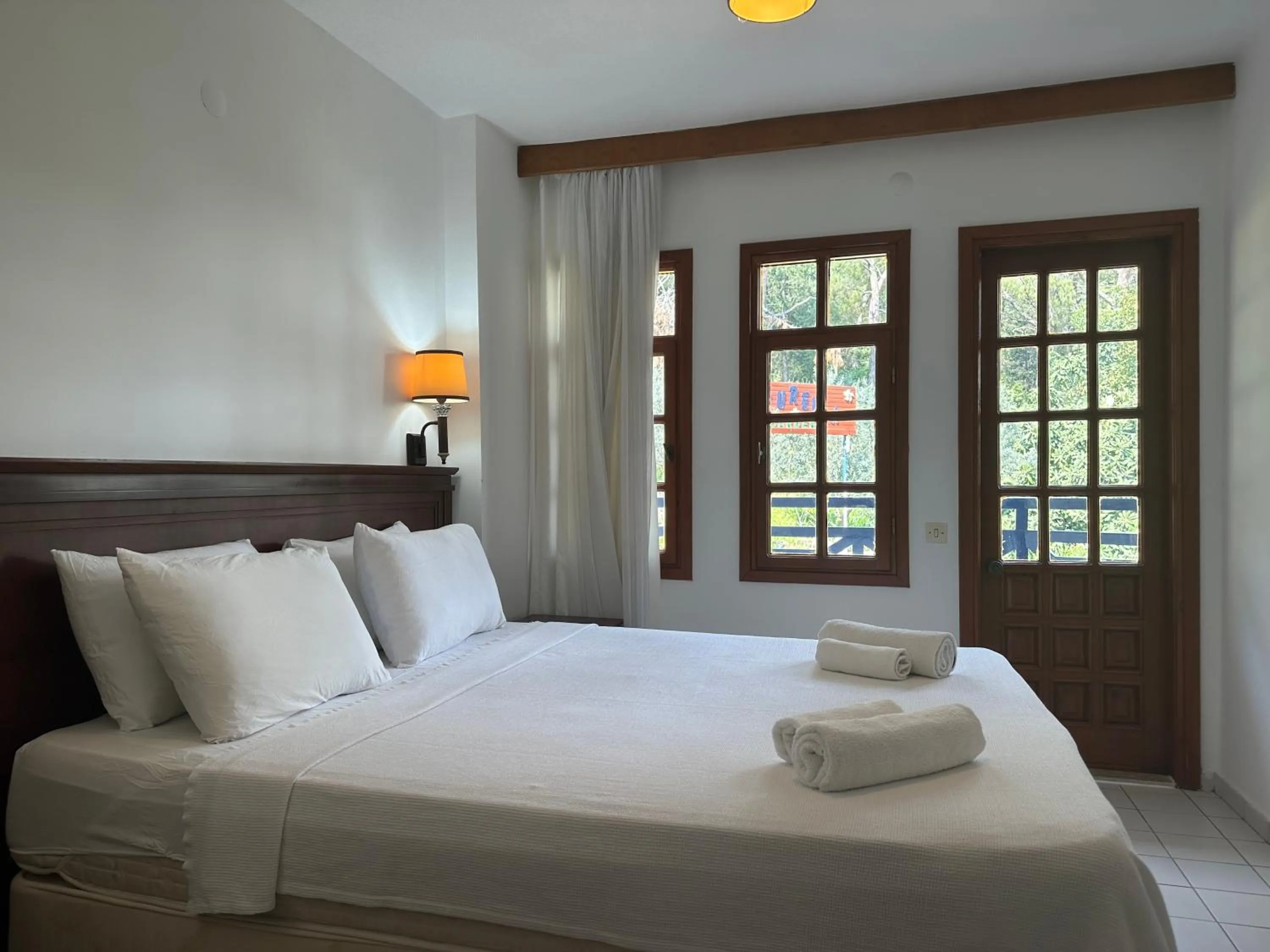 Bed in NATURELLA APART HOTEL