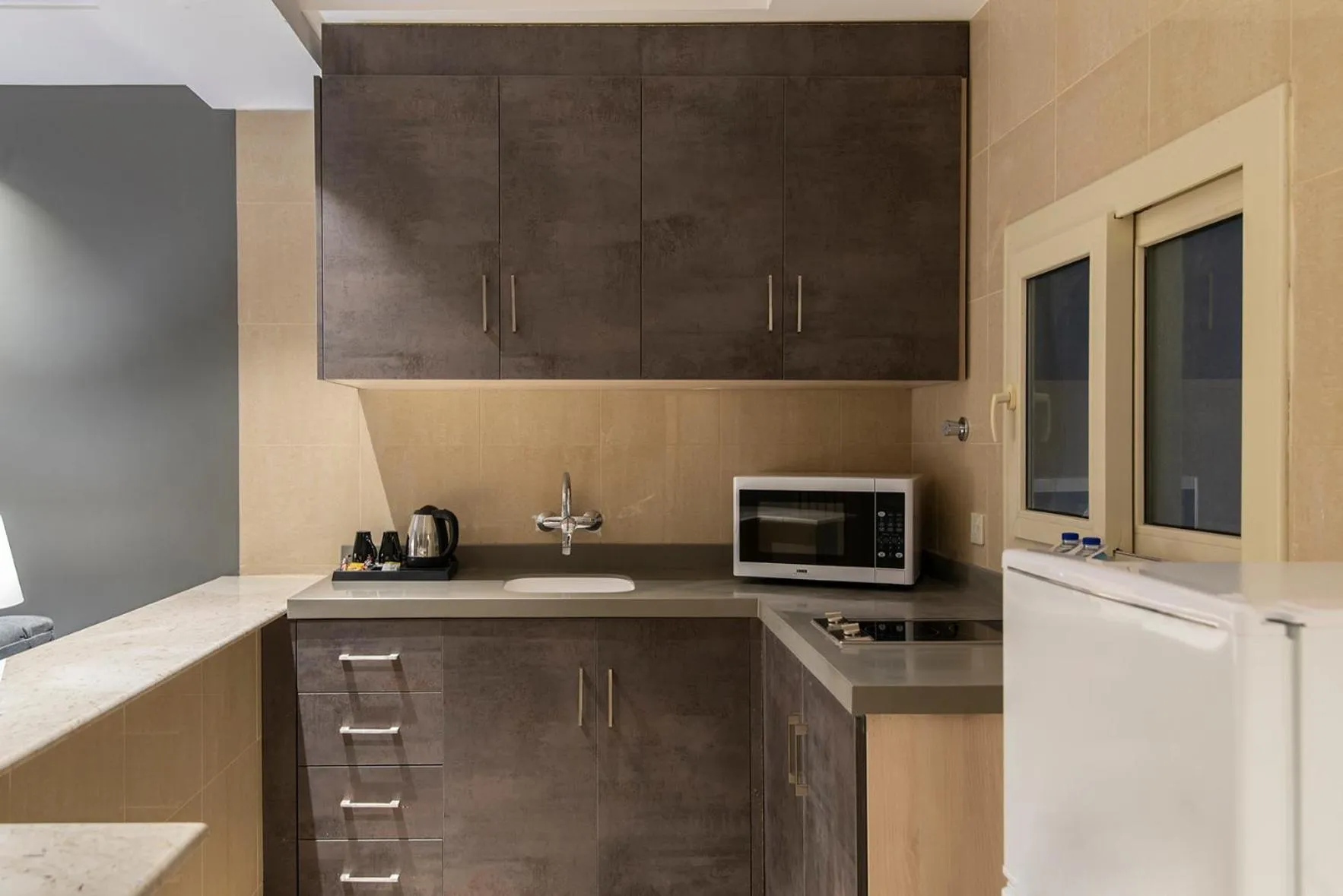 kitchen in Enala Hotel Apartments- Tabuk