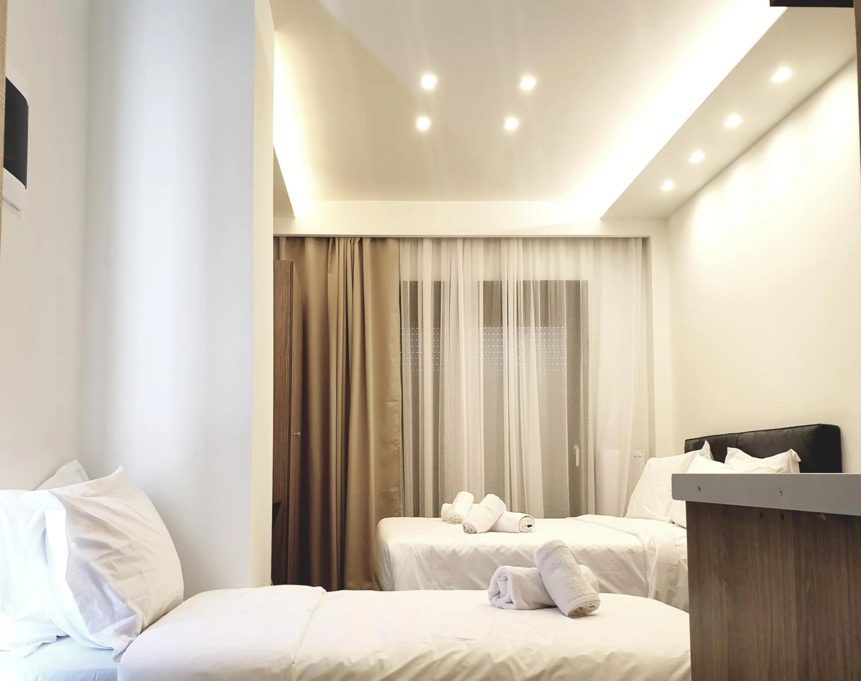 Bed in Eantos Studios and Suites