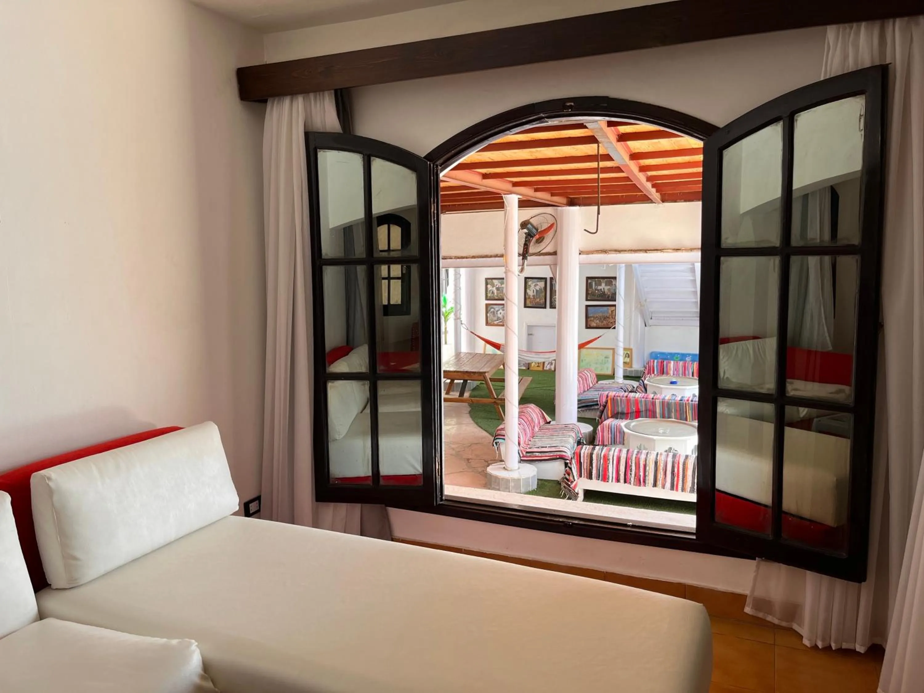 Living room, Bed in Sanafir Hotel - El Pacha Suites Sharm - Adults Only
