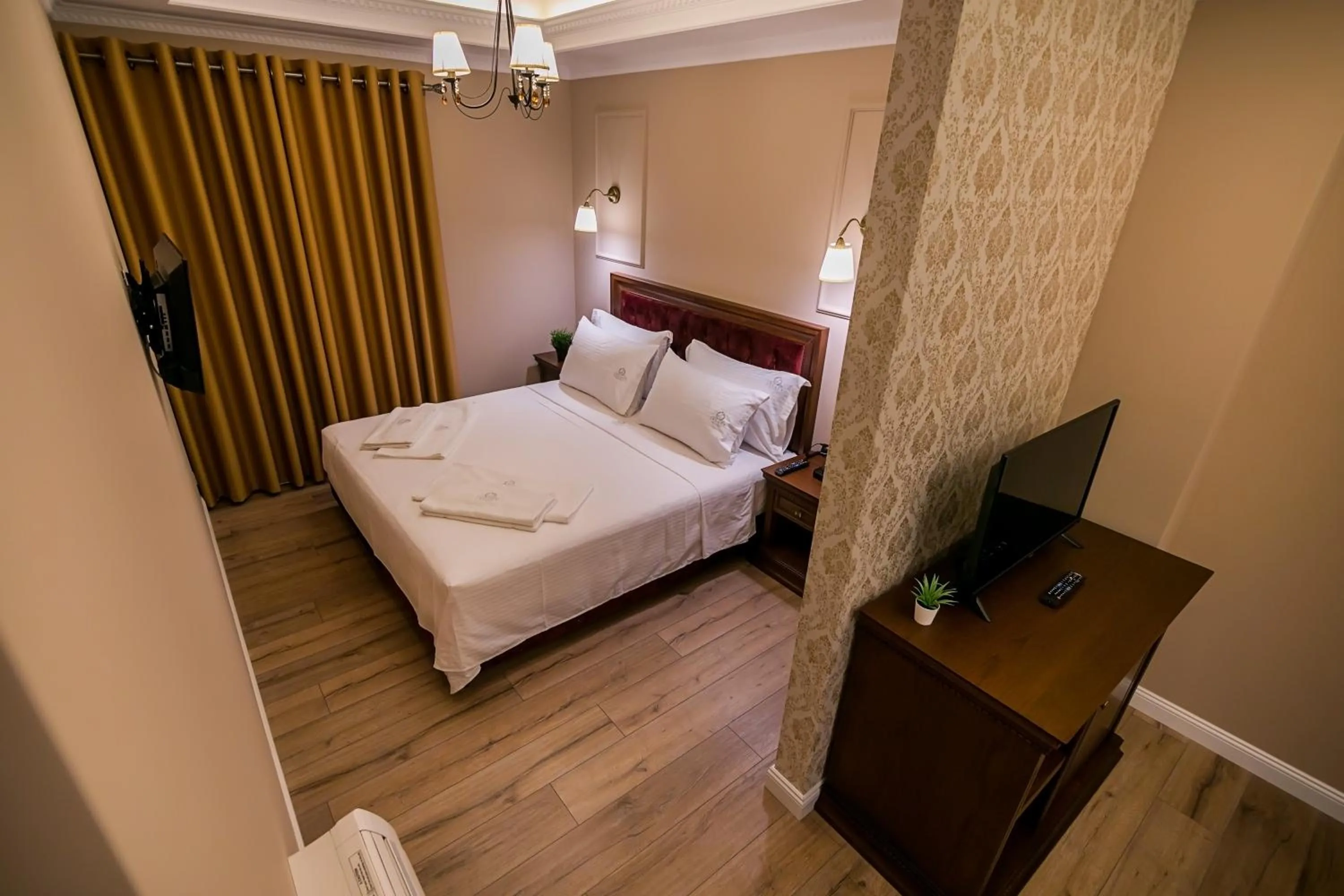 Bed in Legacy Boutique Hotel