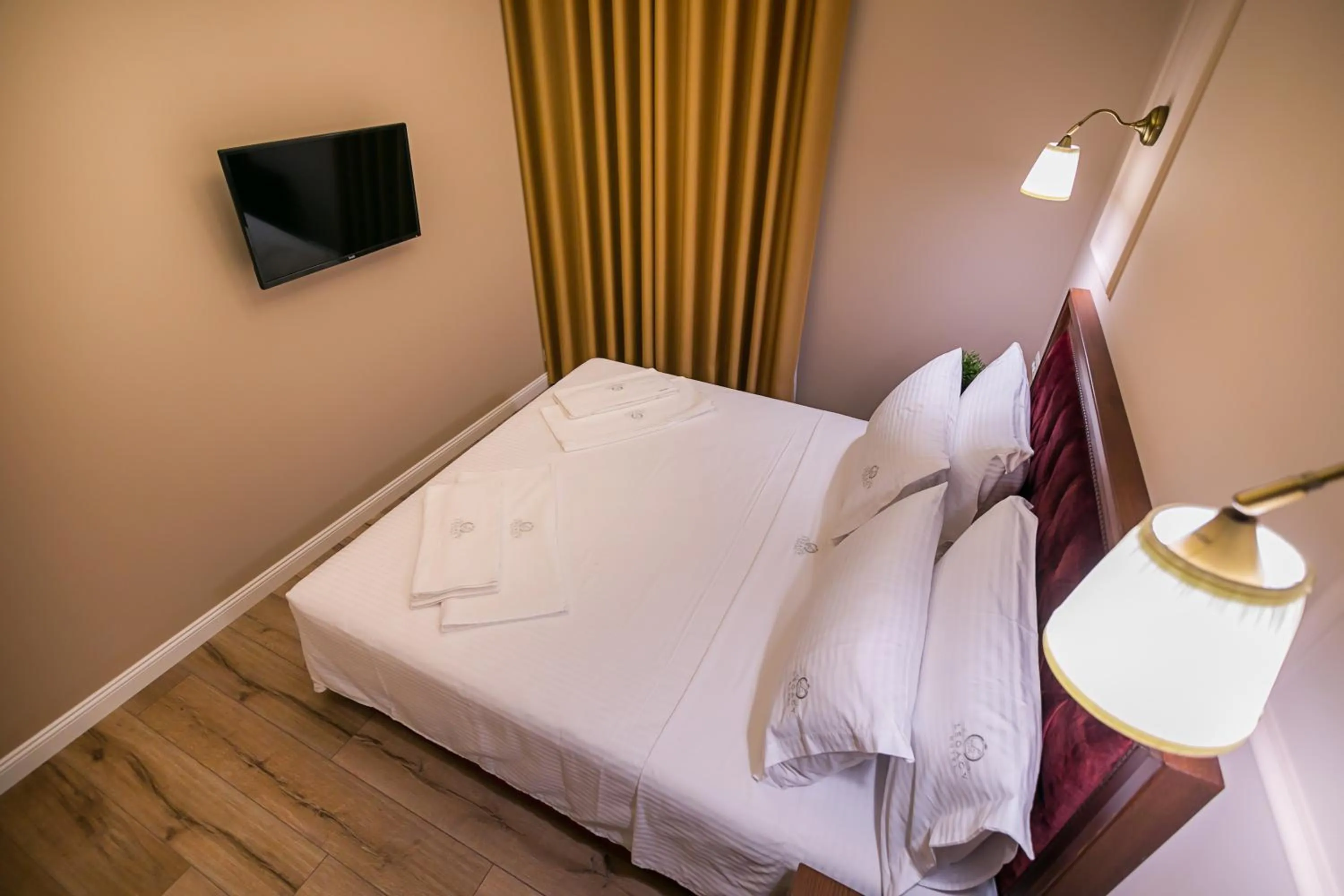 Bed in Legacy Boutique Hotel