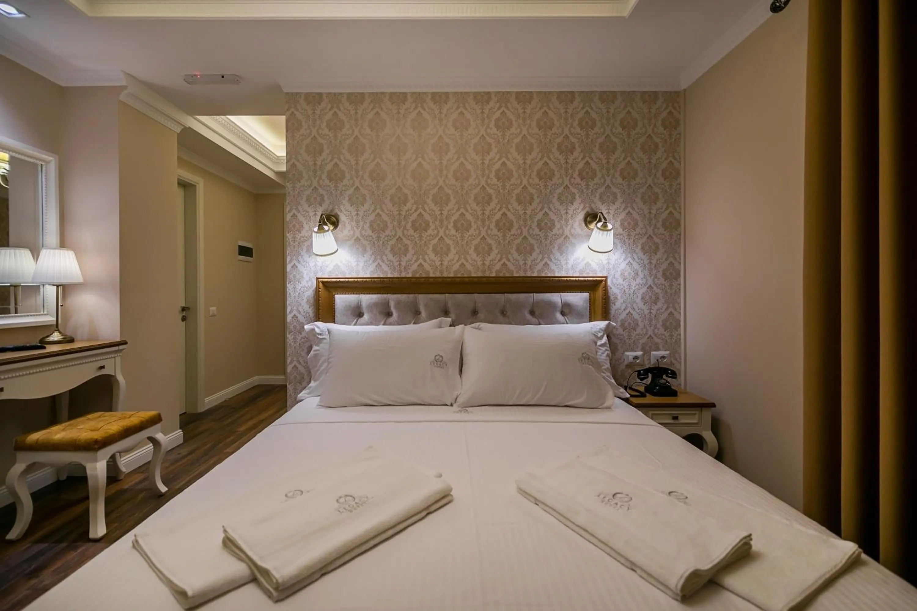 Bed in Legacy Boutique Hotel