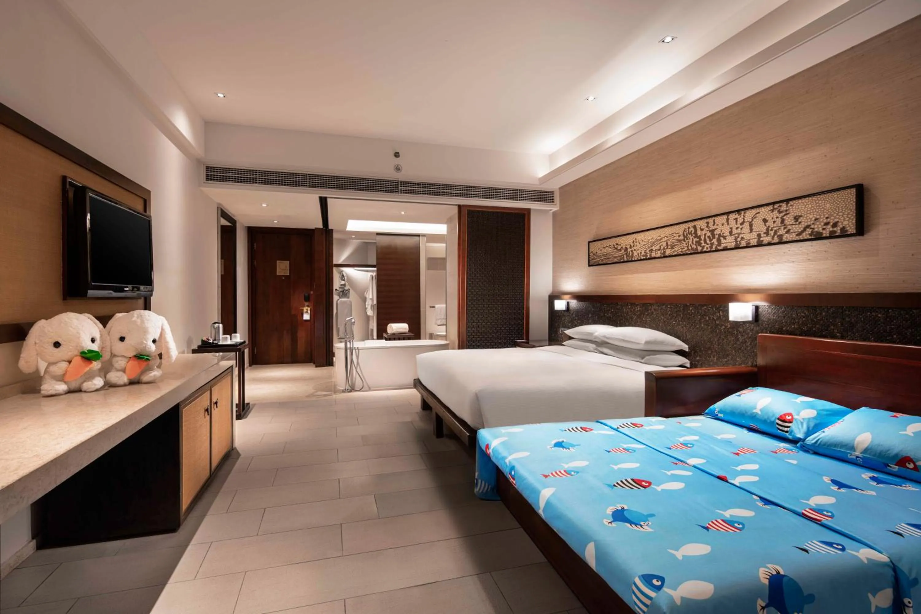 Photo of the whole room, Bed in Wanda Realm Resort Sanya Haitang Bay