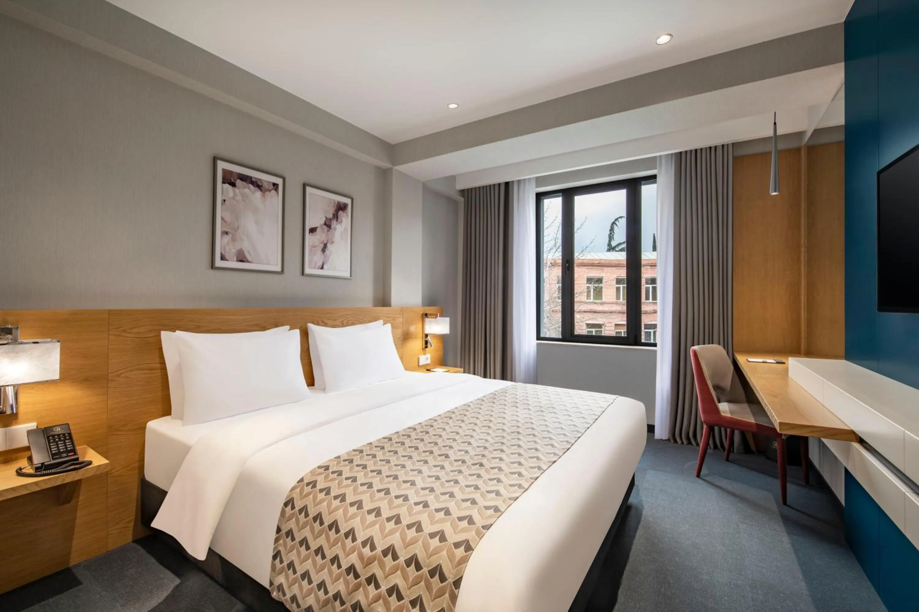 Bed in Clocks Hotel Tbilisi