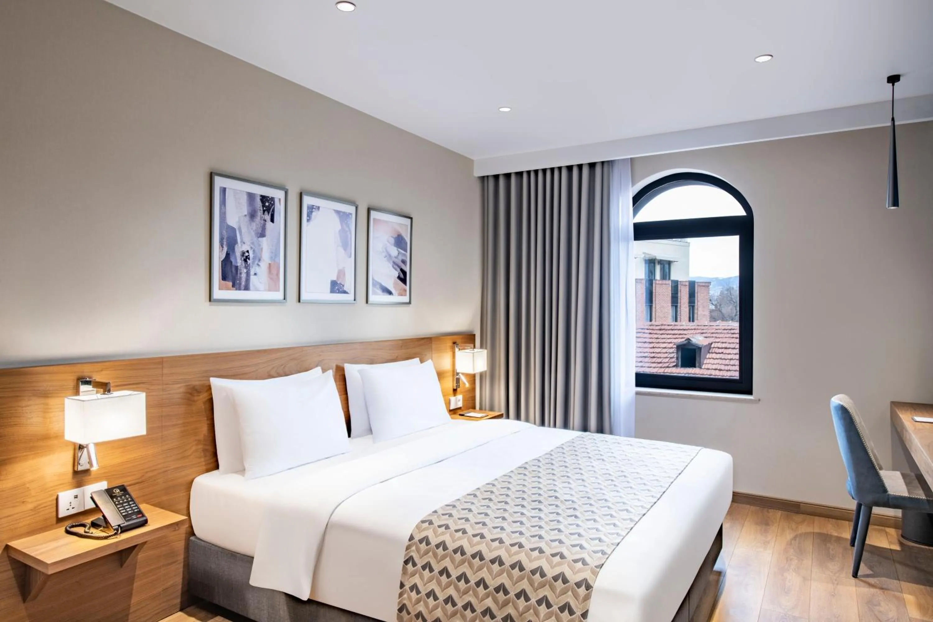 Bed in Clocks Hotel Tbilisi