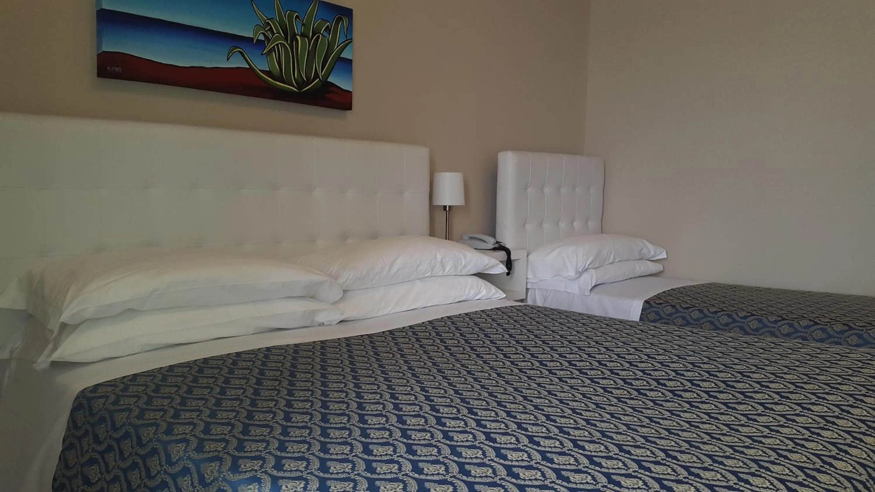 Bed in Hotel Lo Scoglio