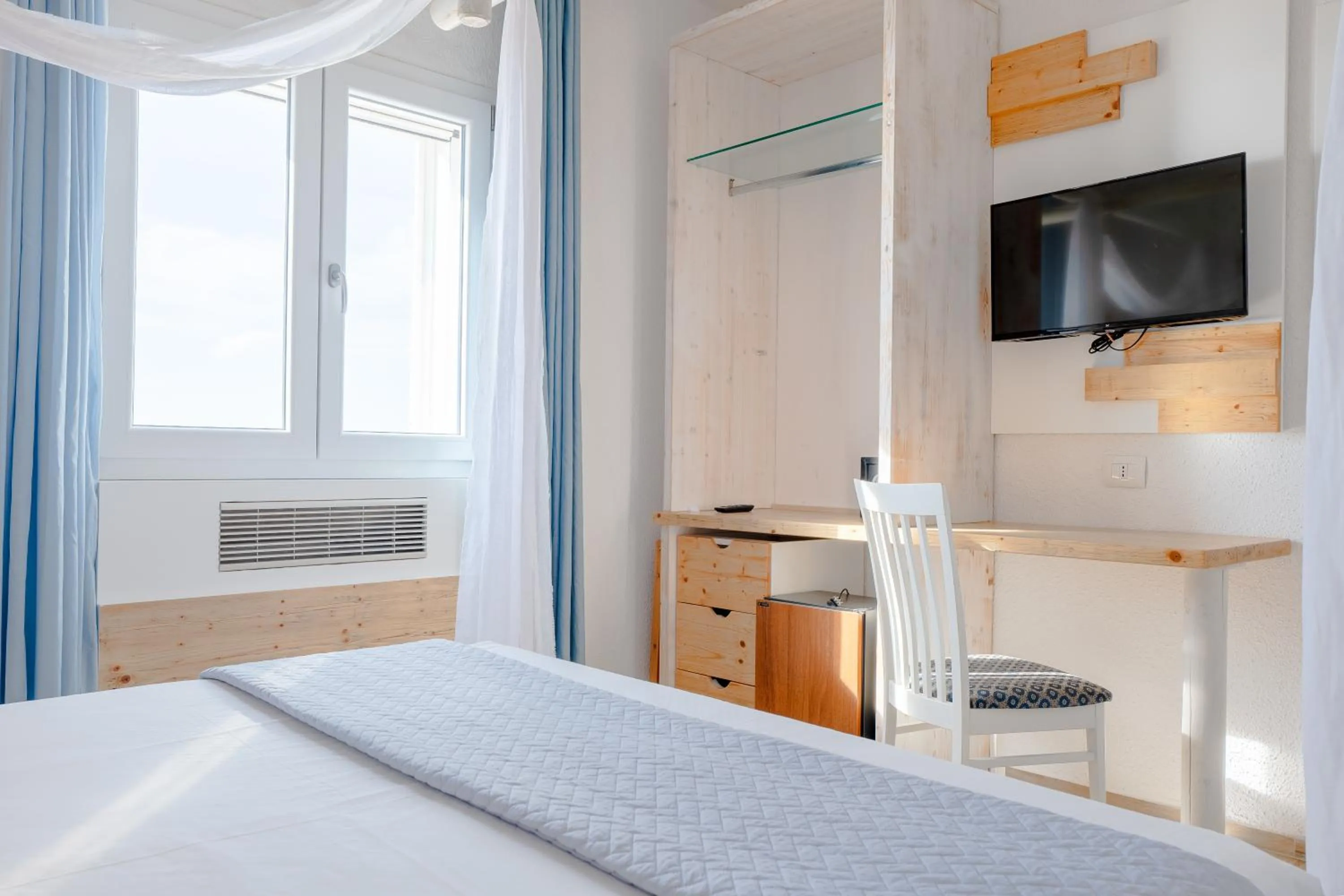 Bed in Hotel Lo Scoglio