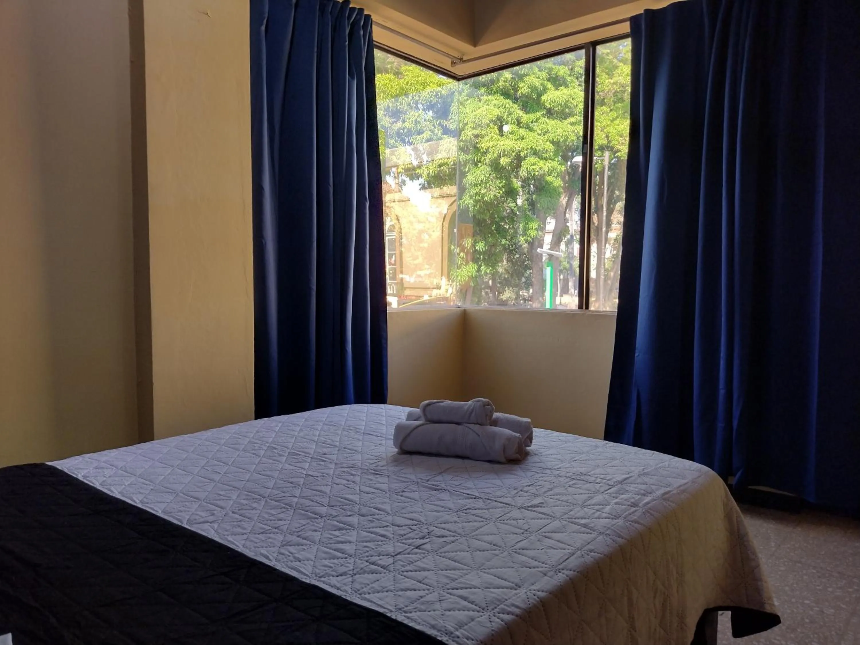 View (from property/room), Bed in Hotel Alajuela Costa Rica Airport