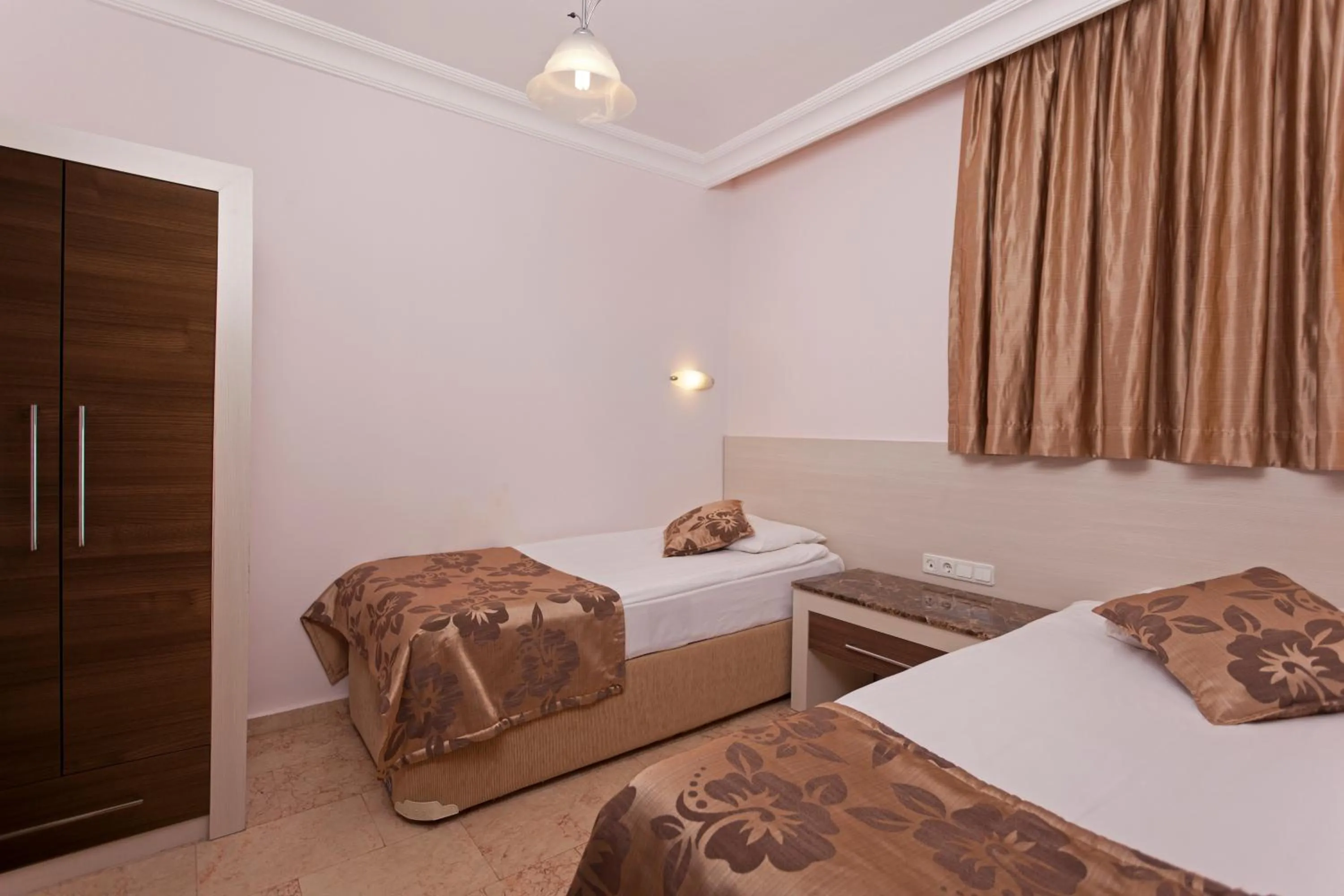 Bed in Club Paradiso Hotel