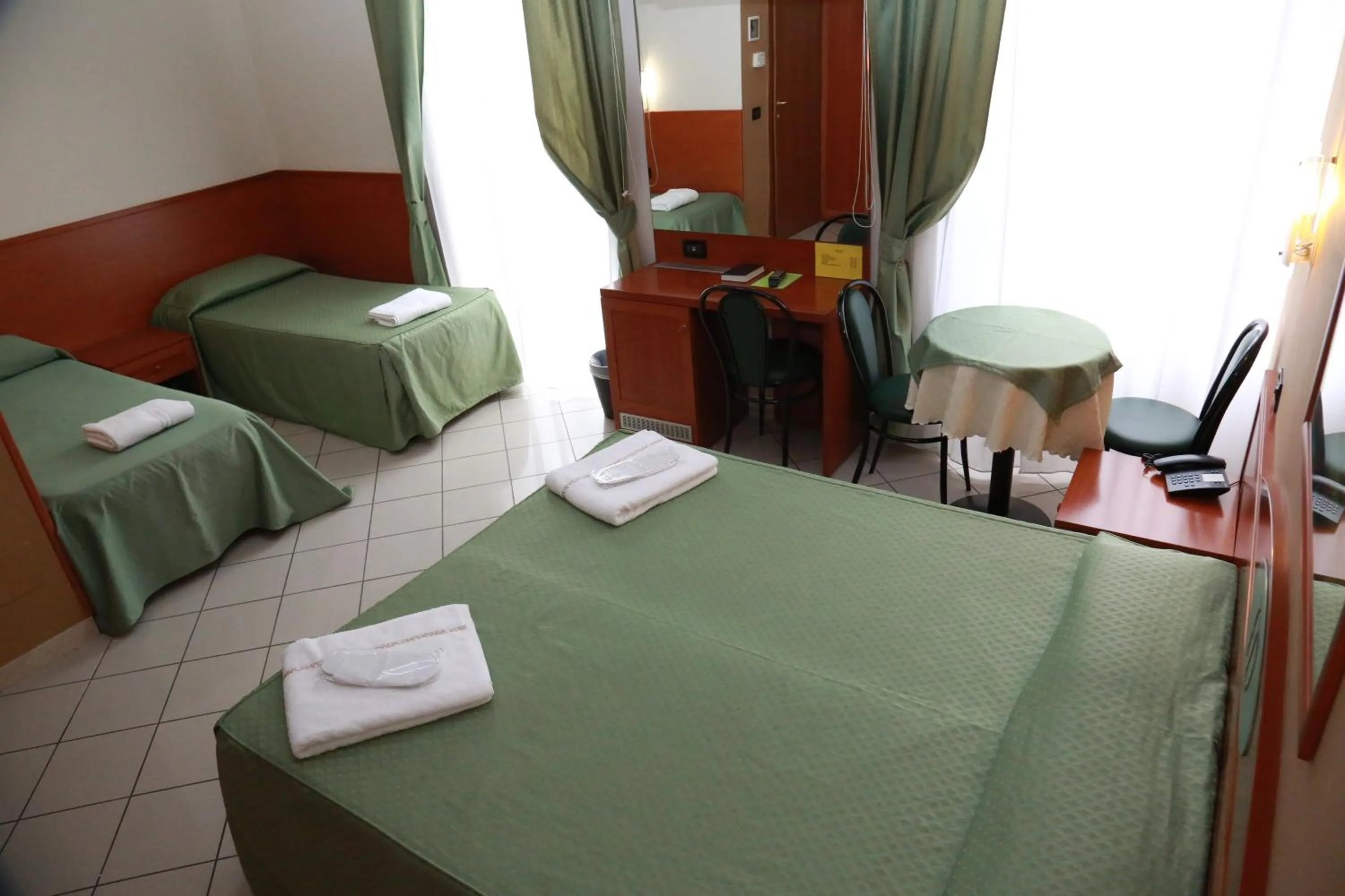 Bed in Hotel Dorè