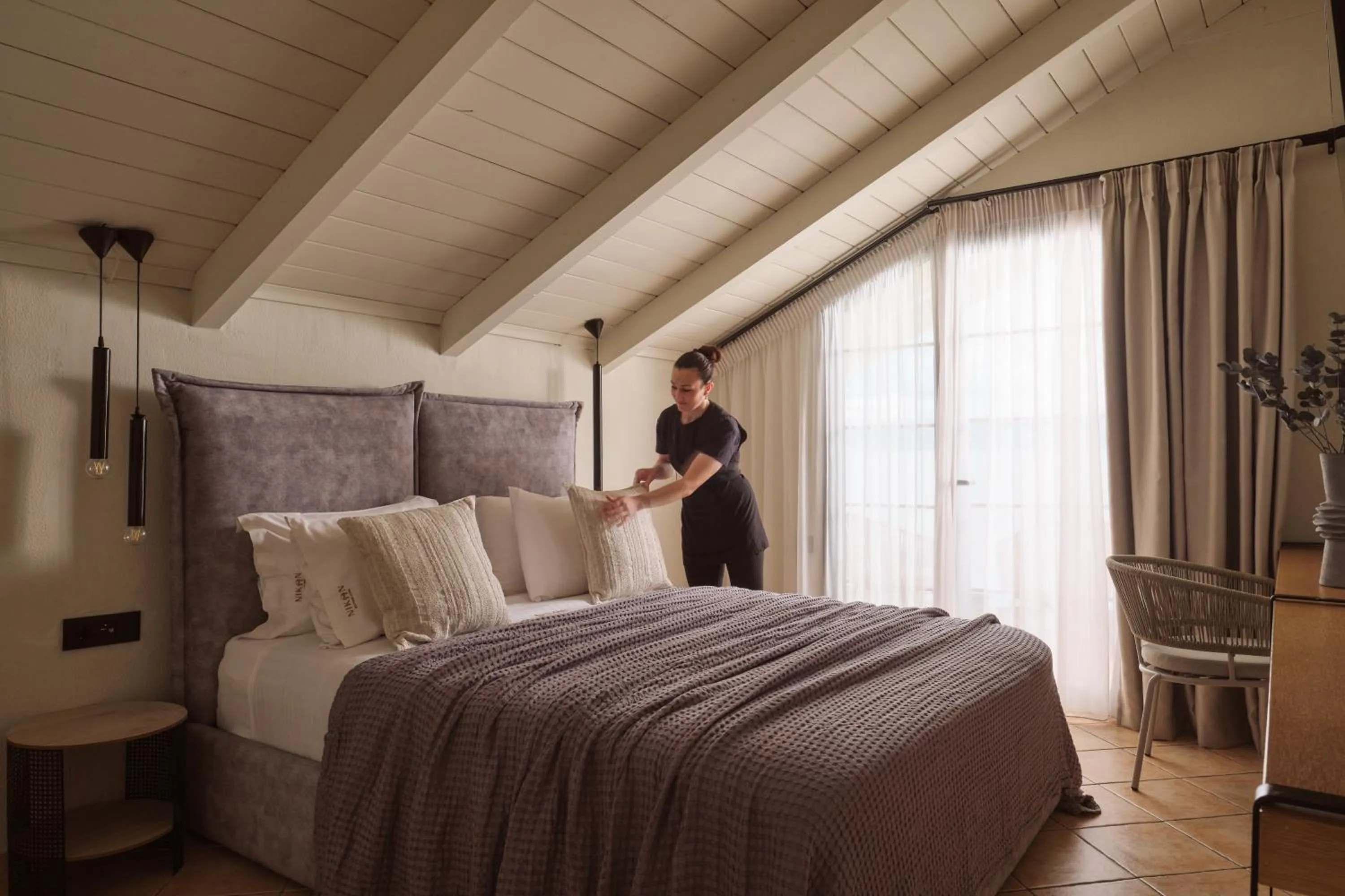 Bed in Nikon Boutique Hotel