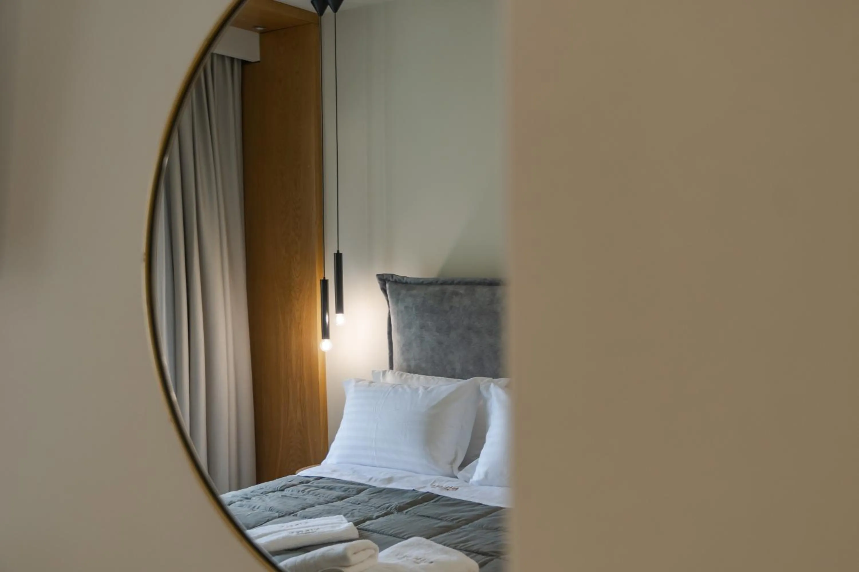 Bed in Nikon Boutique Hotel