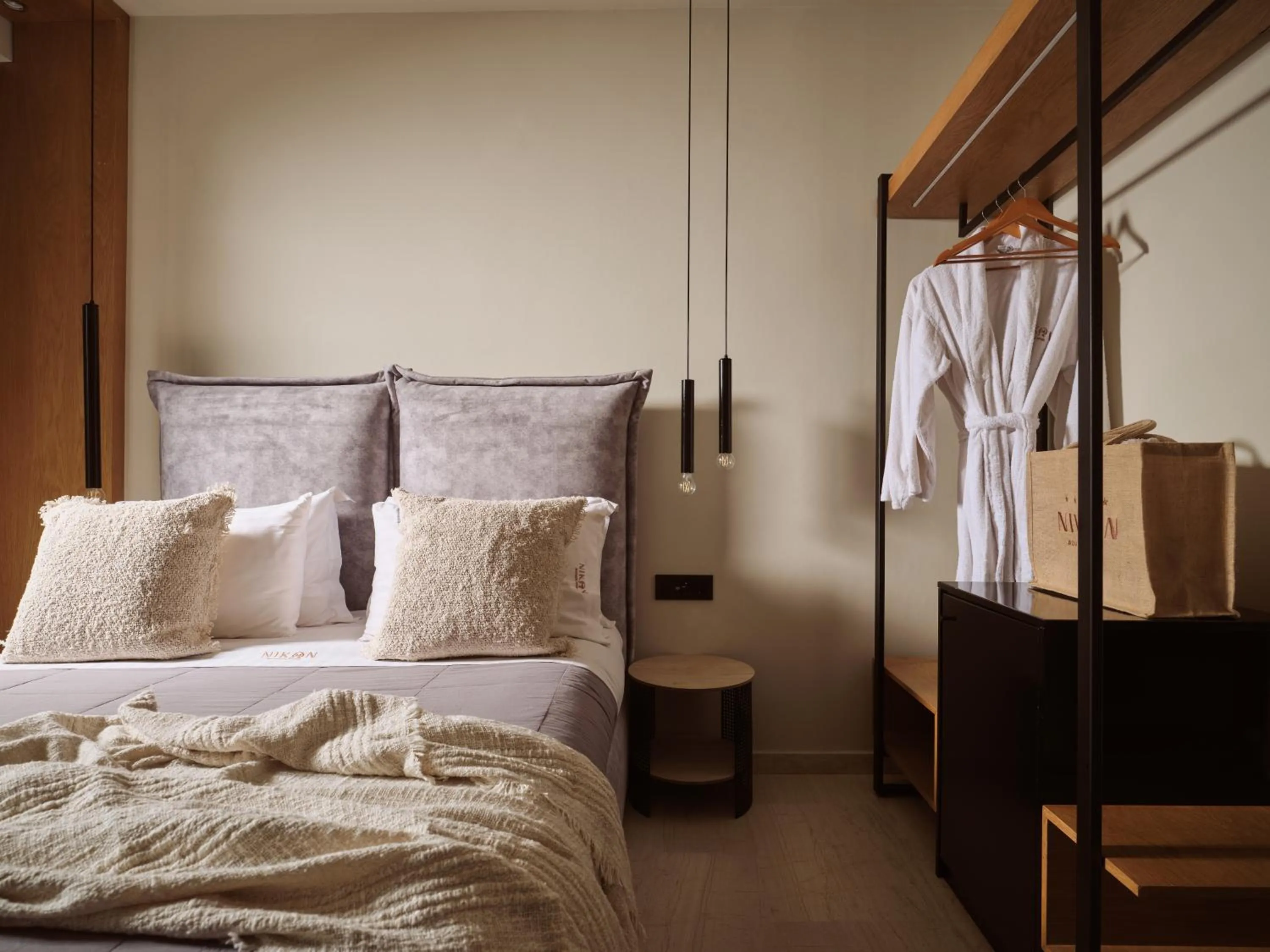 Bed in Nikon Boutique Hotel