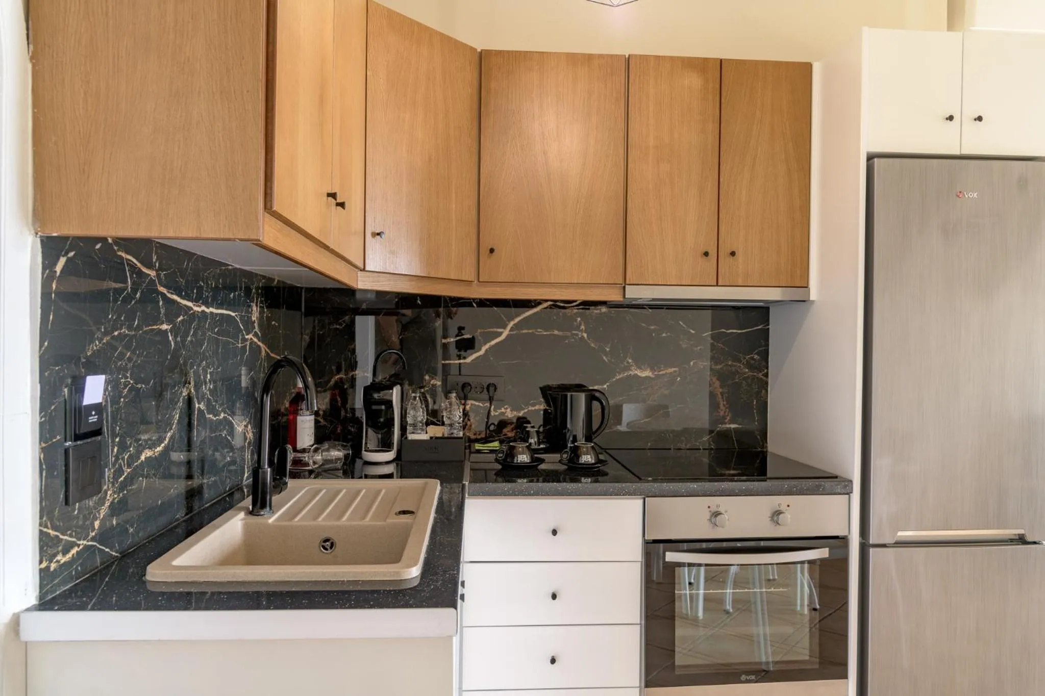 Kitchen or kitchenette in Nikon Boutique Hotel