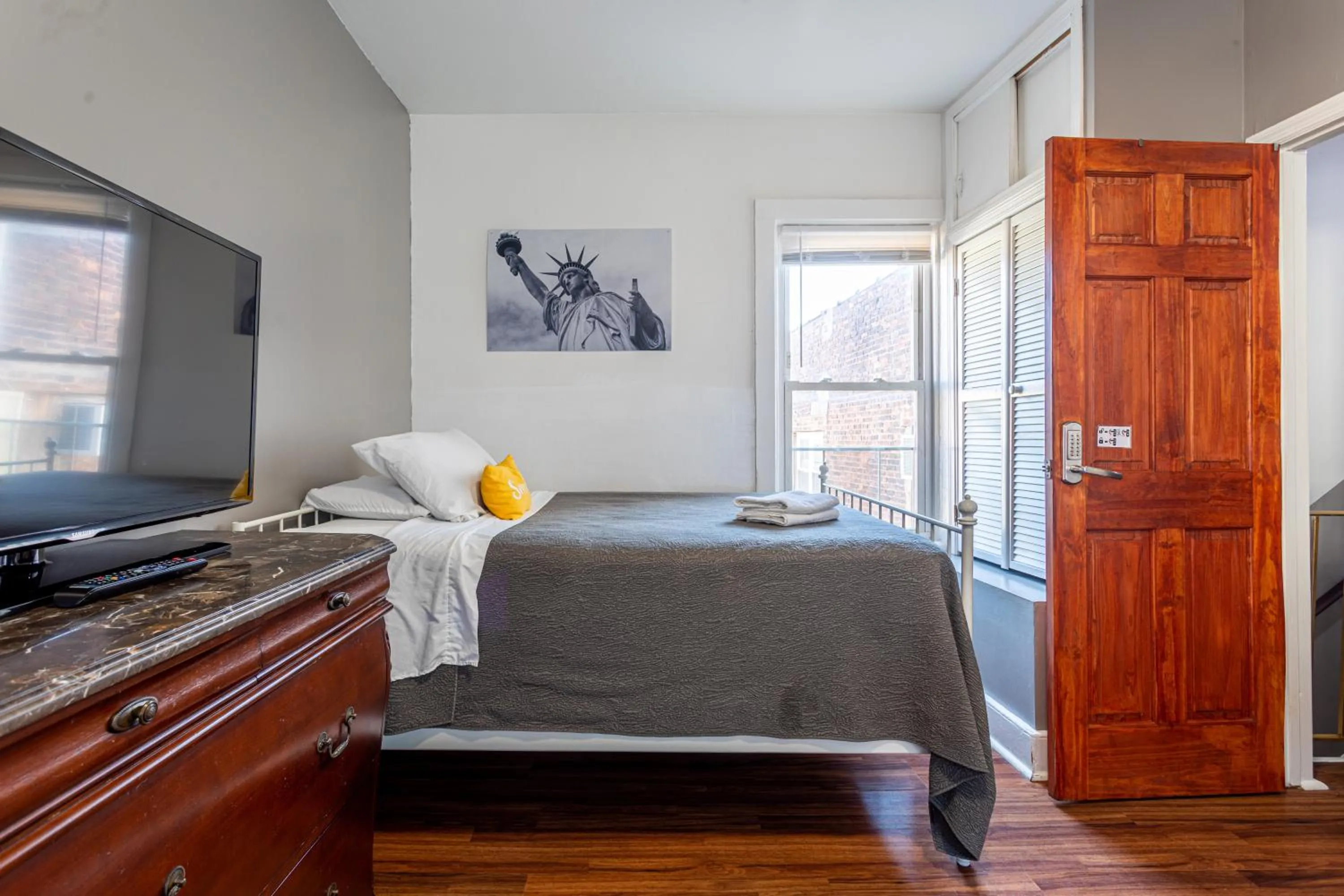 Photo of the whole room, Bed in Best Room To Visit NYC-Subway Access