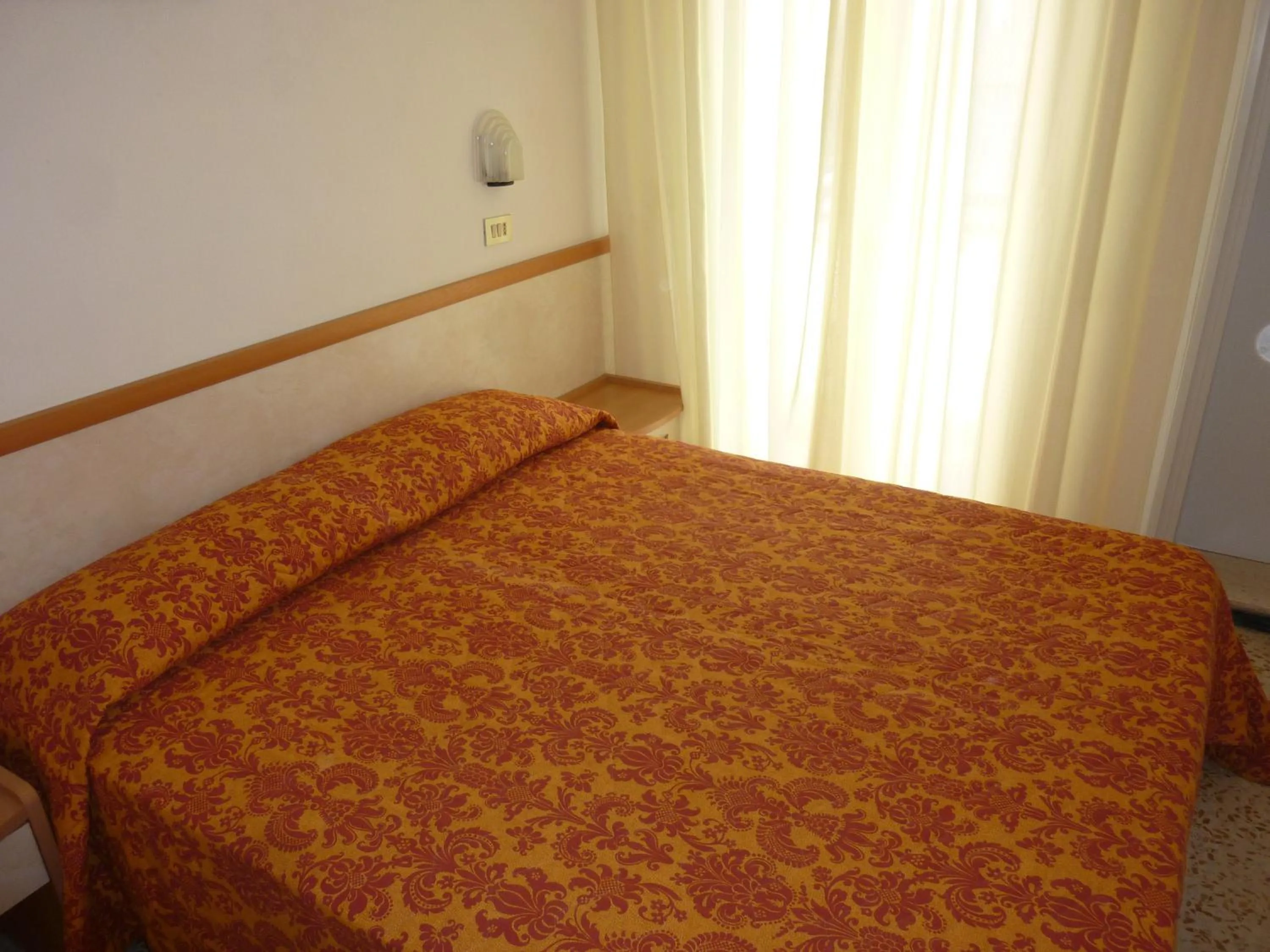 Bed in Hotel Apis