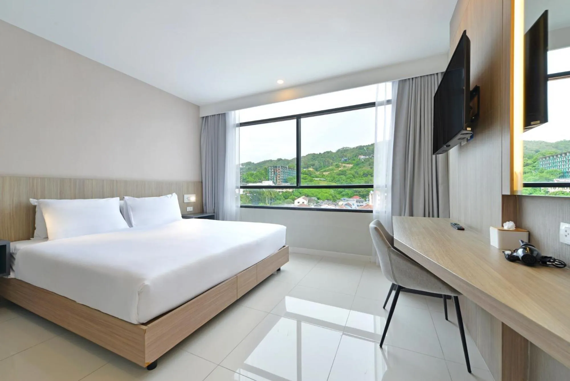 Bed in Grace Patong Hotel