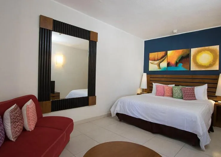 Bed in Grand Decameron Los Cabos, A Trademark All-Inclusive Resort