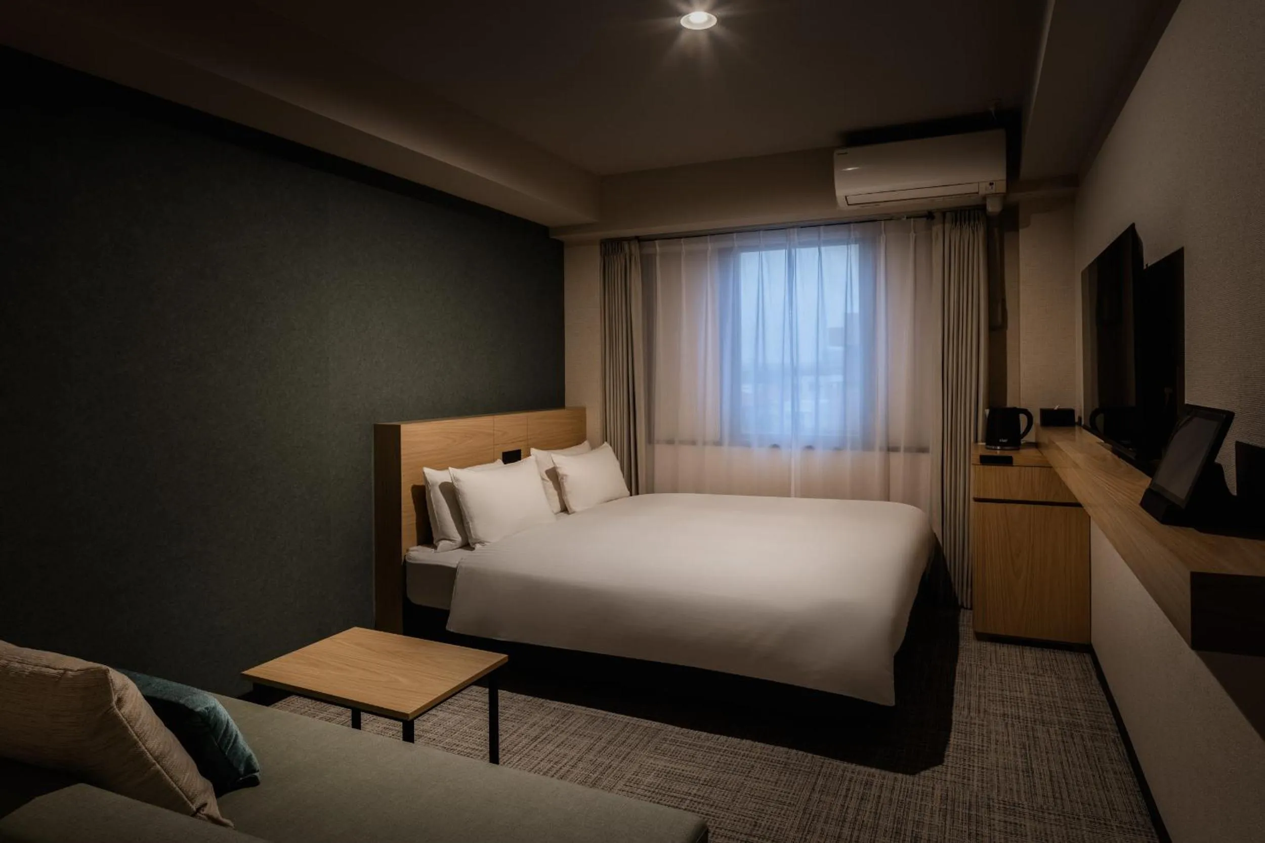 Photo of the whole room, Bed in Nest Hotel Ishigaki Maesato Beach