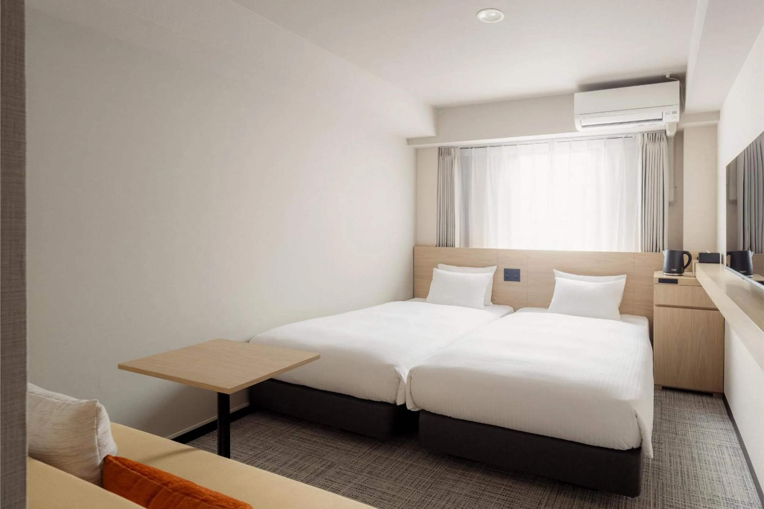 Photo of the whole room, Bed in Nest Hotel Ishigaki Maesato Beach