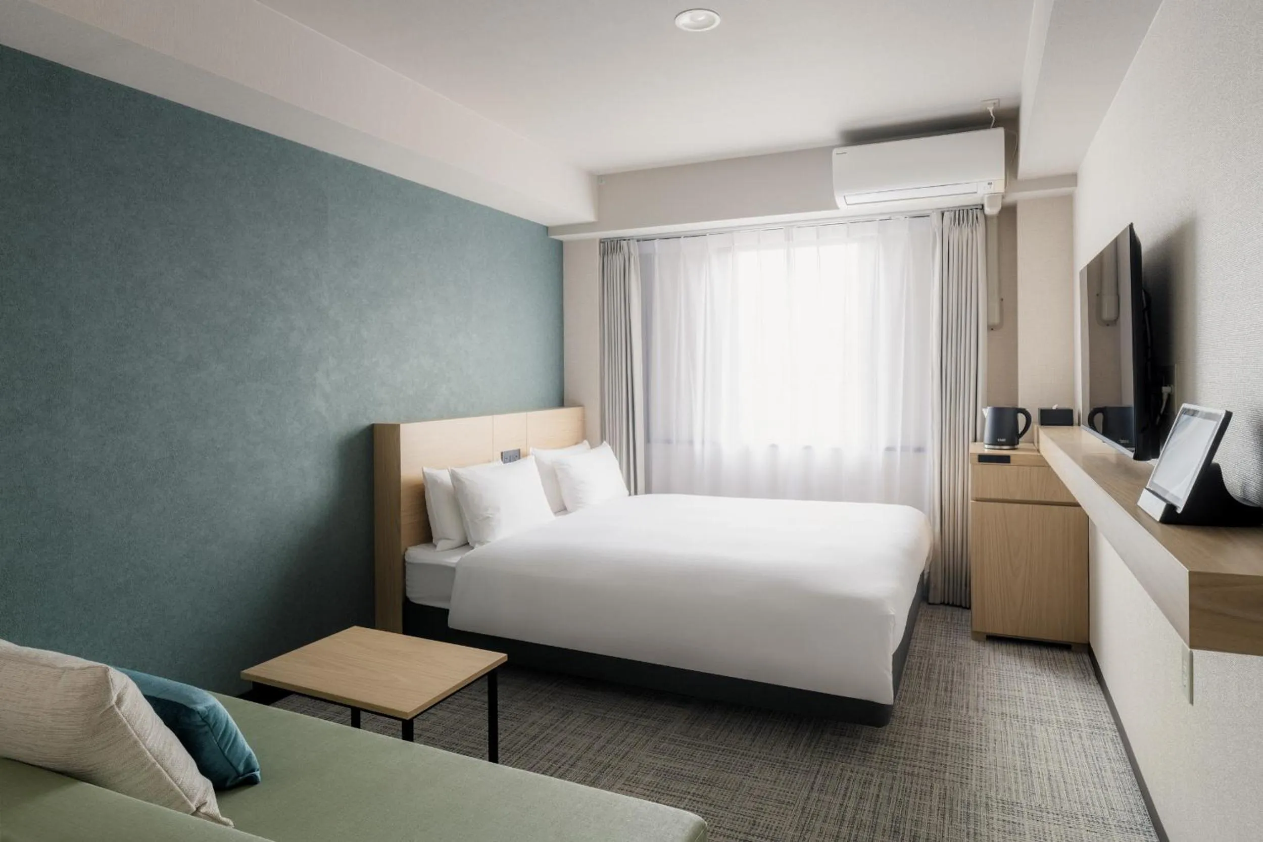 Photo of the whole room, Bed in Nest Hotel Ishigaki Maesato Beach