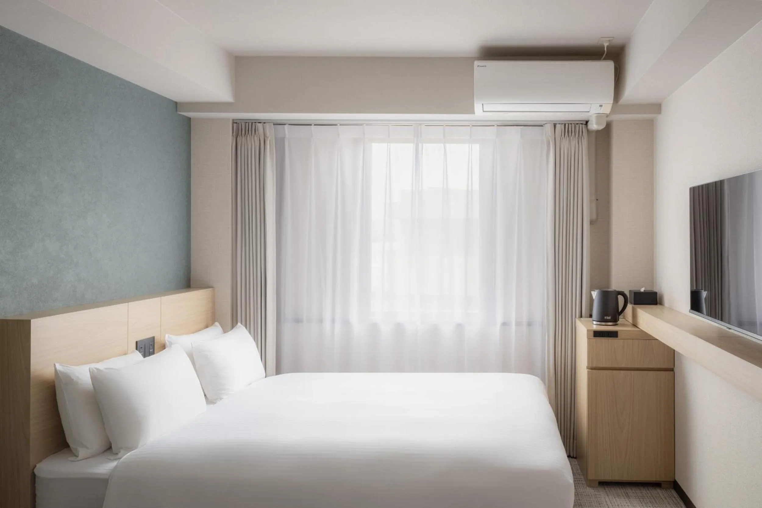 Photo of the whole room, Bed in Nest Hotel Ishigaki Maesato Beach