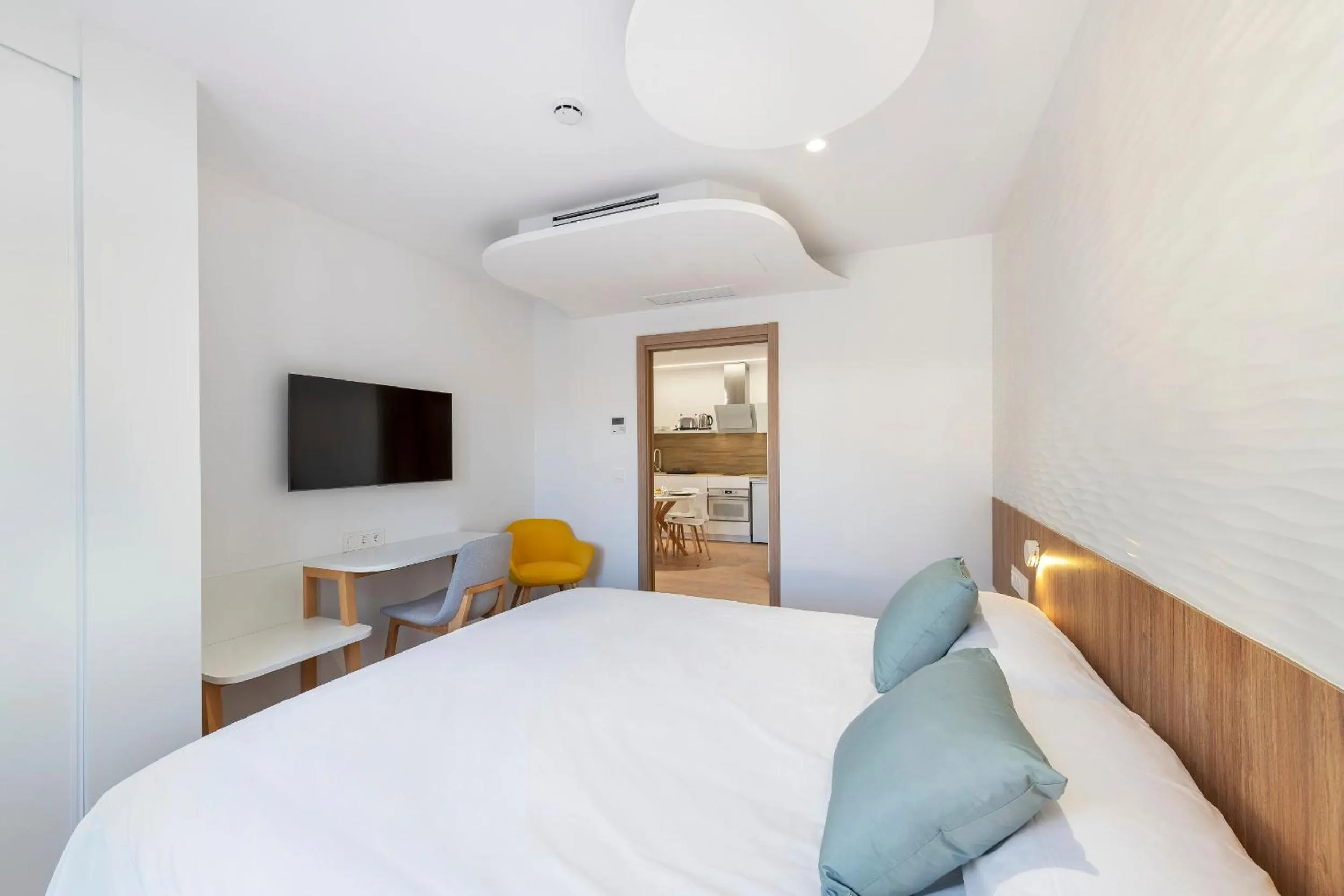 Bed in Odyssey Rooms Alicante