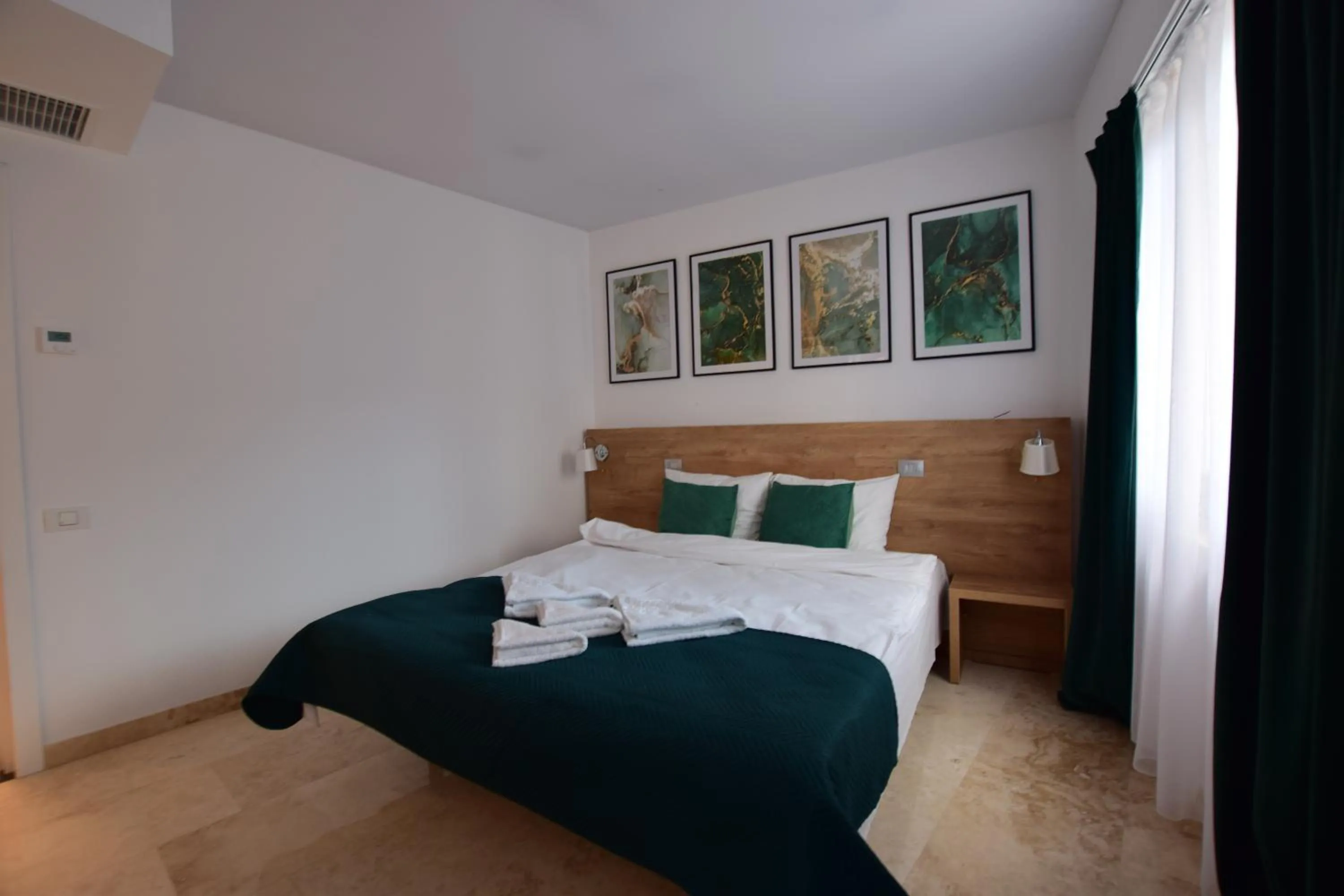 Bed in Dacia Residence Apartments