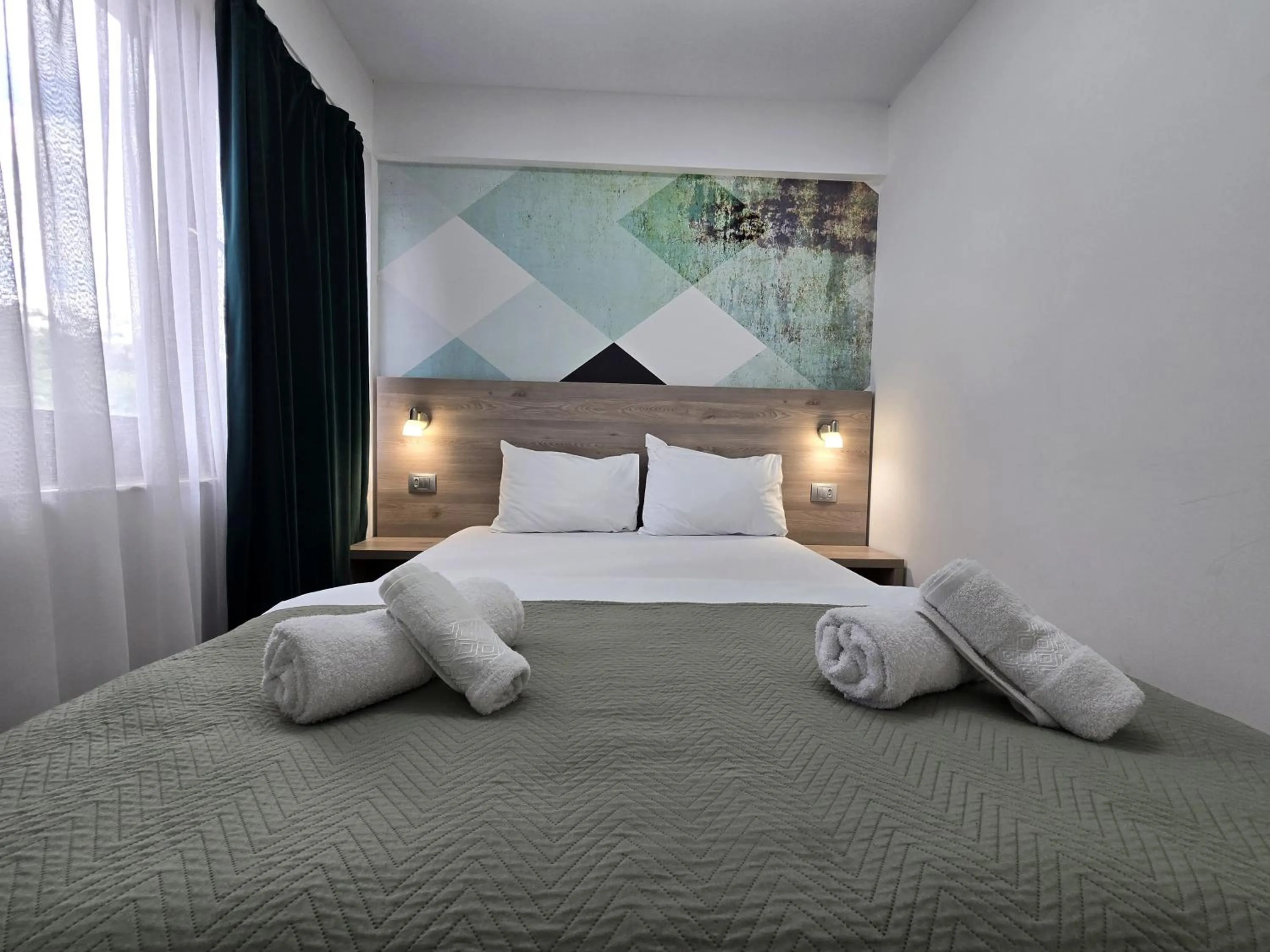 Bed in Dacia Residence Apartments