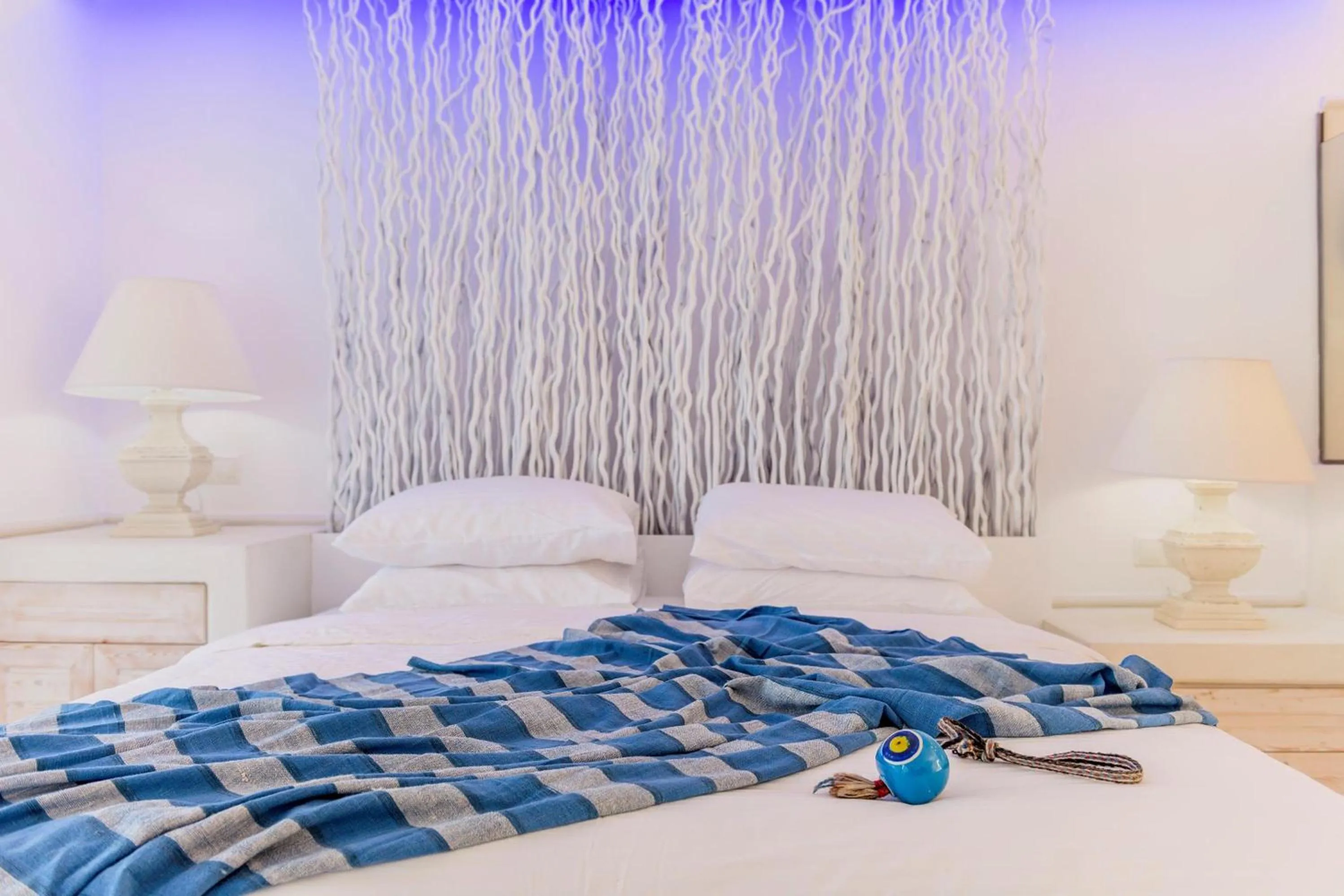 Bed in Kouros Home & Suites