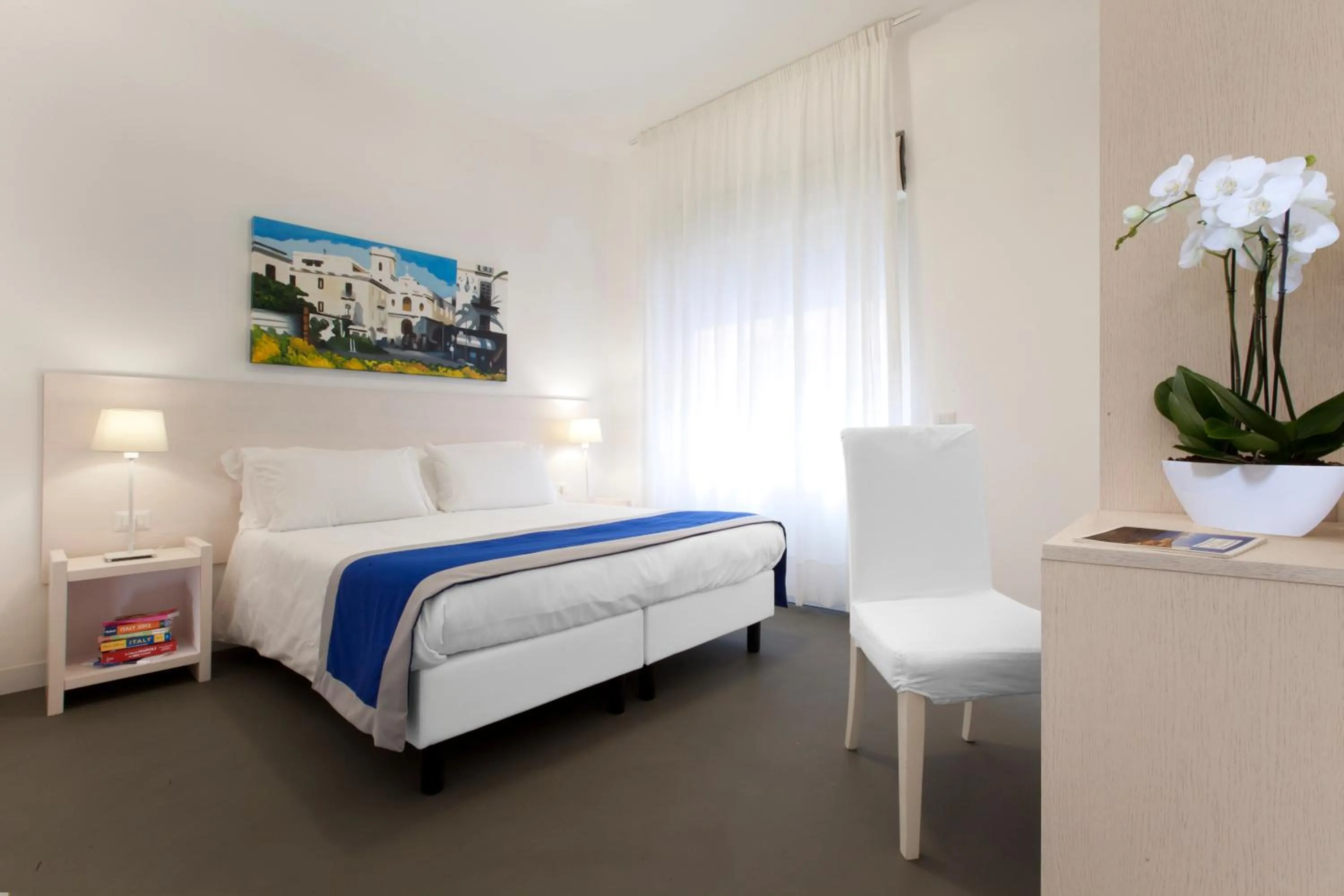 Bed in Hotel Tasso Suites & Spa