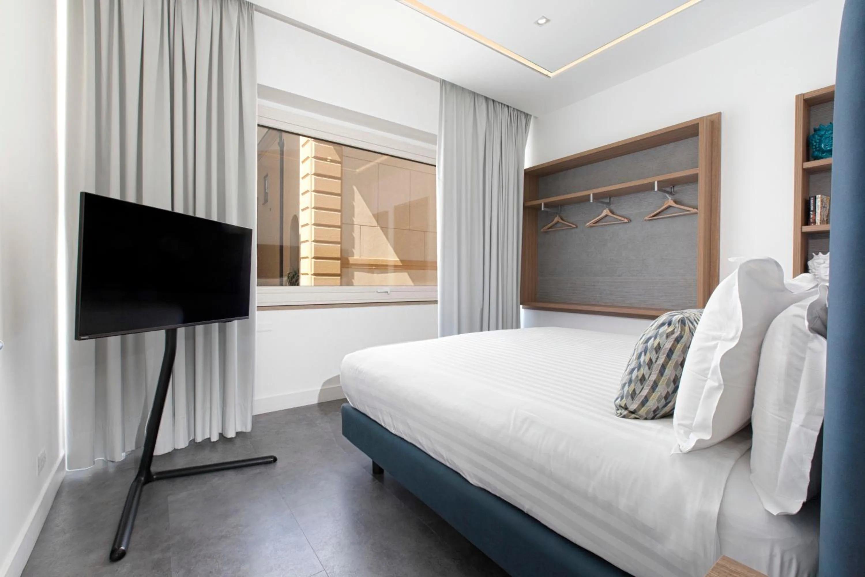 Bedroom, Bed in Hotel Tasso Suites & Spa