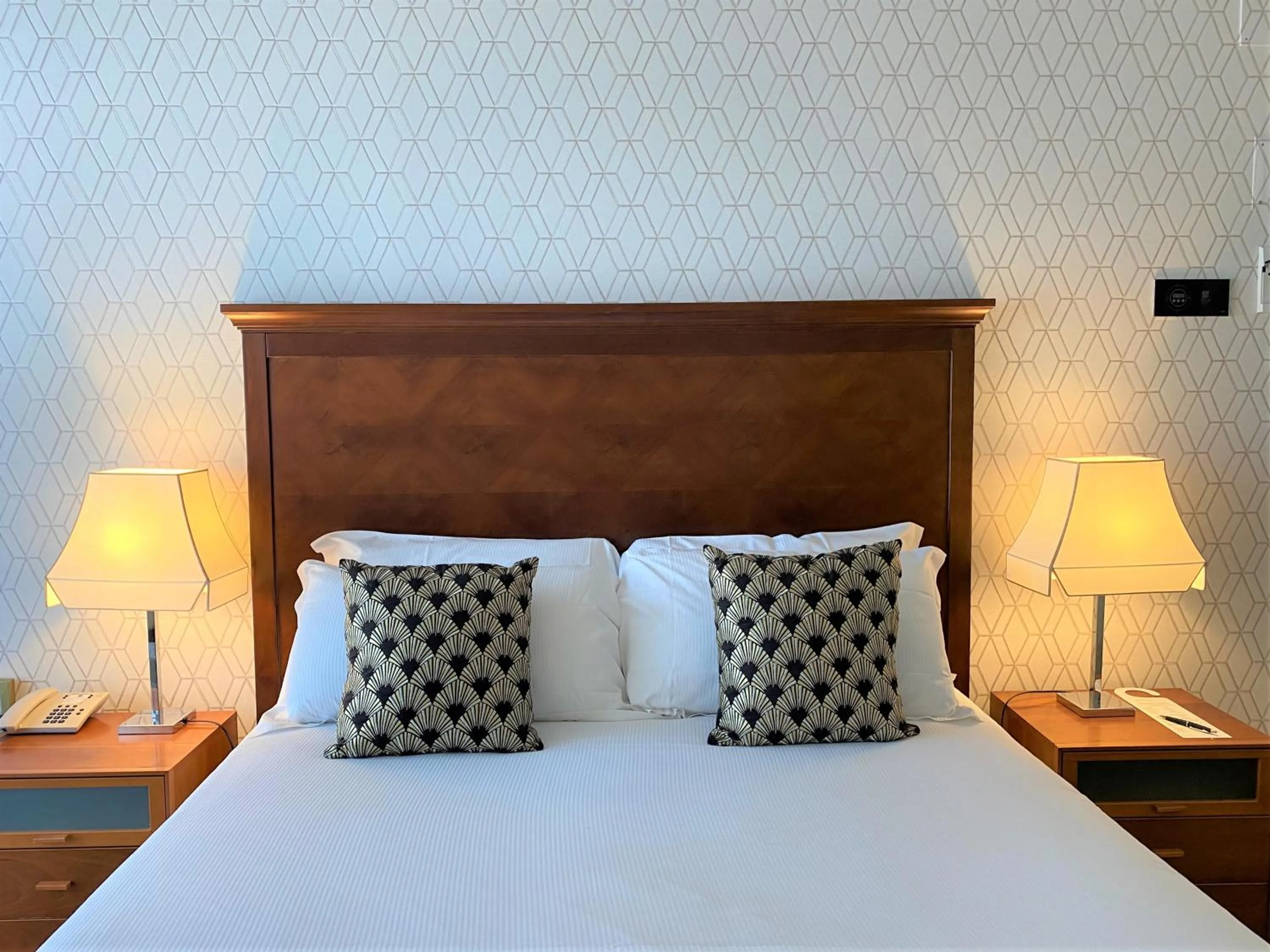 Bed in Savoia Hotel Rimini