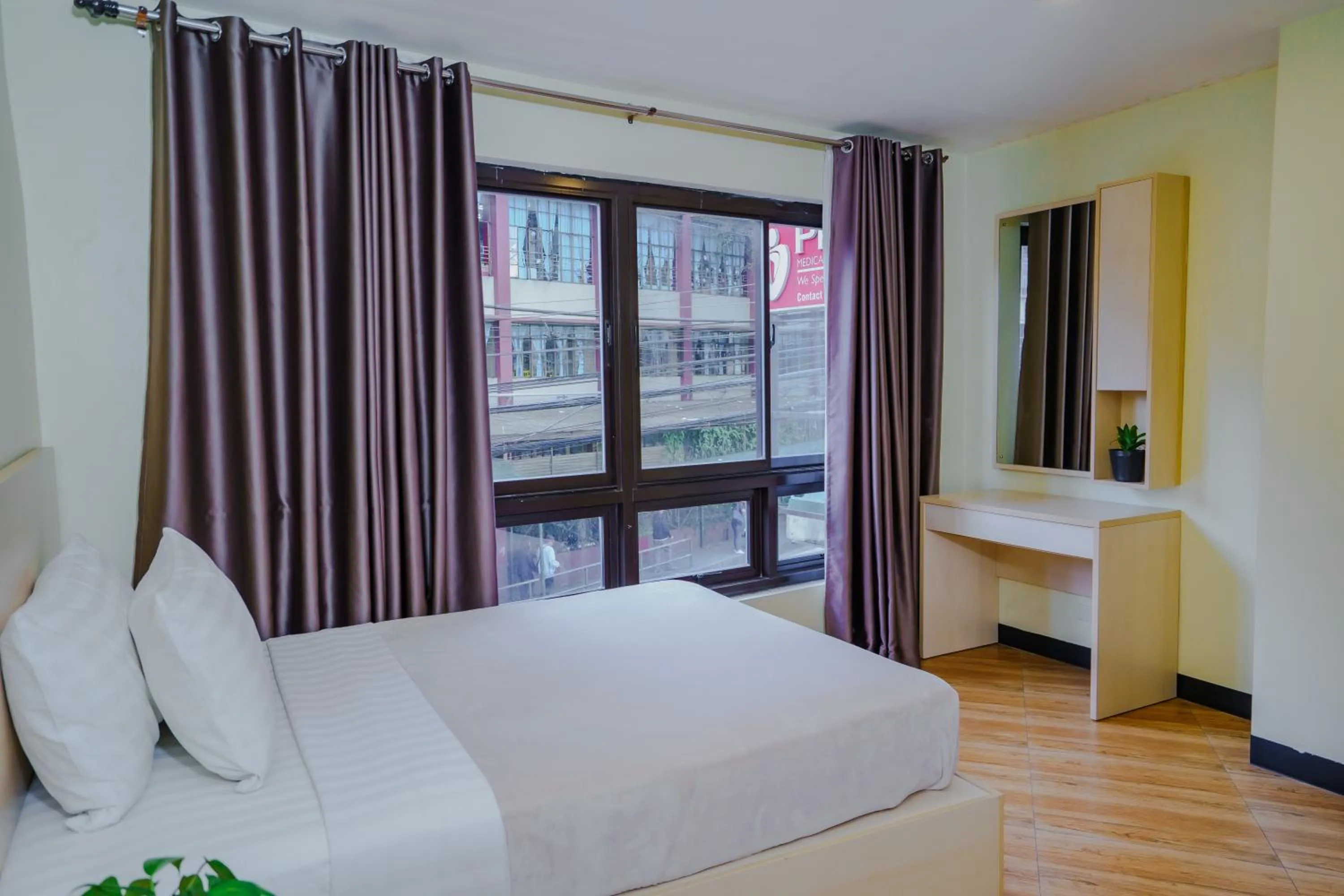 Bedroom, Bed in Olive Town Center and Hotel