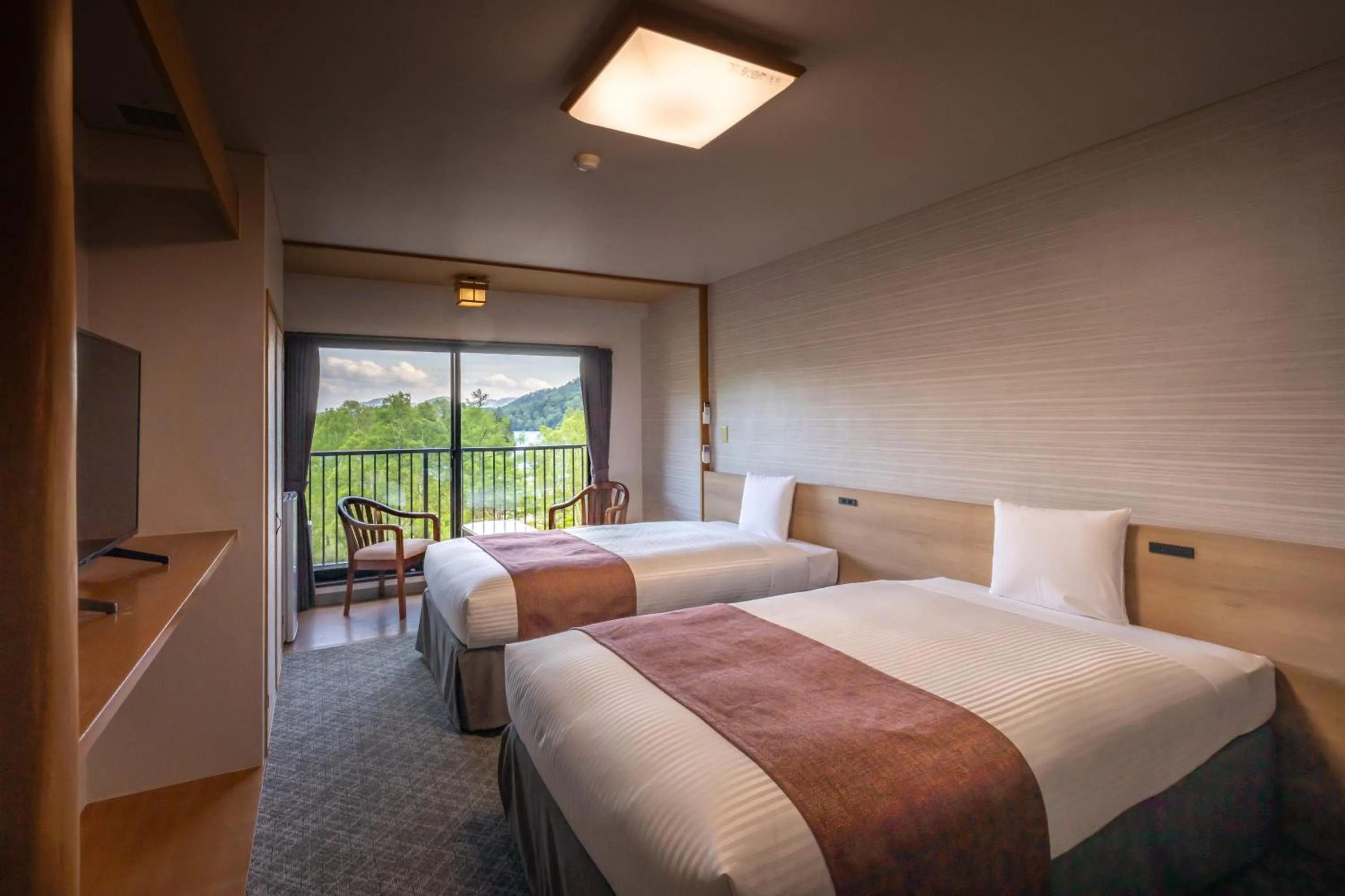 Bed in KAMENOI HOTEL Okunikko