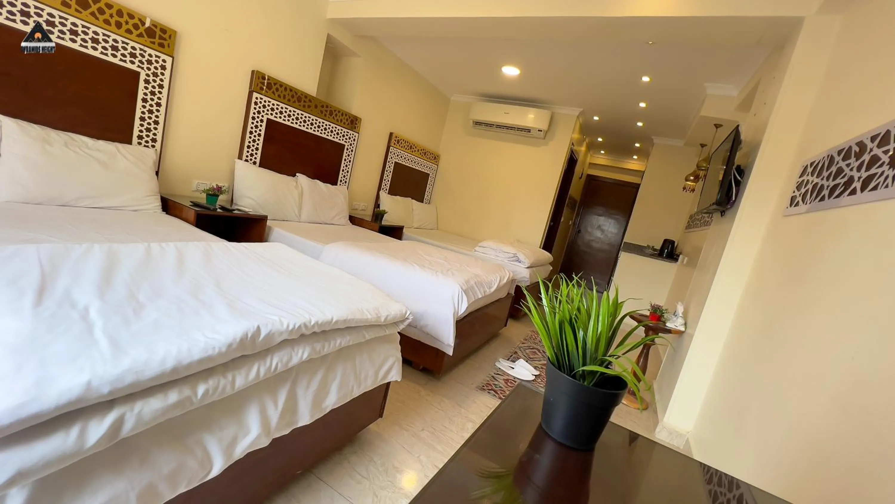 Bed in Pyramids Height Hotel & Pyramids Master Scene Rooftop