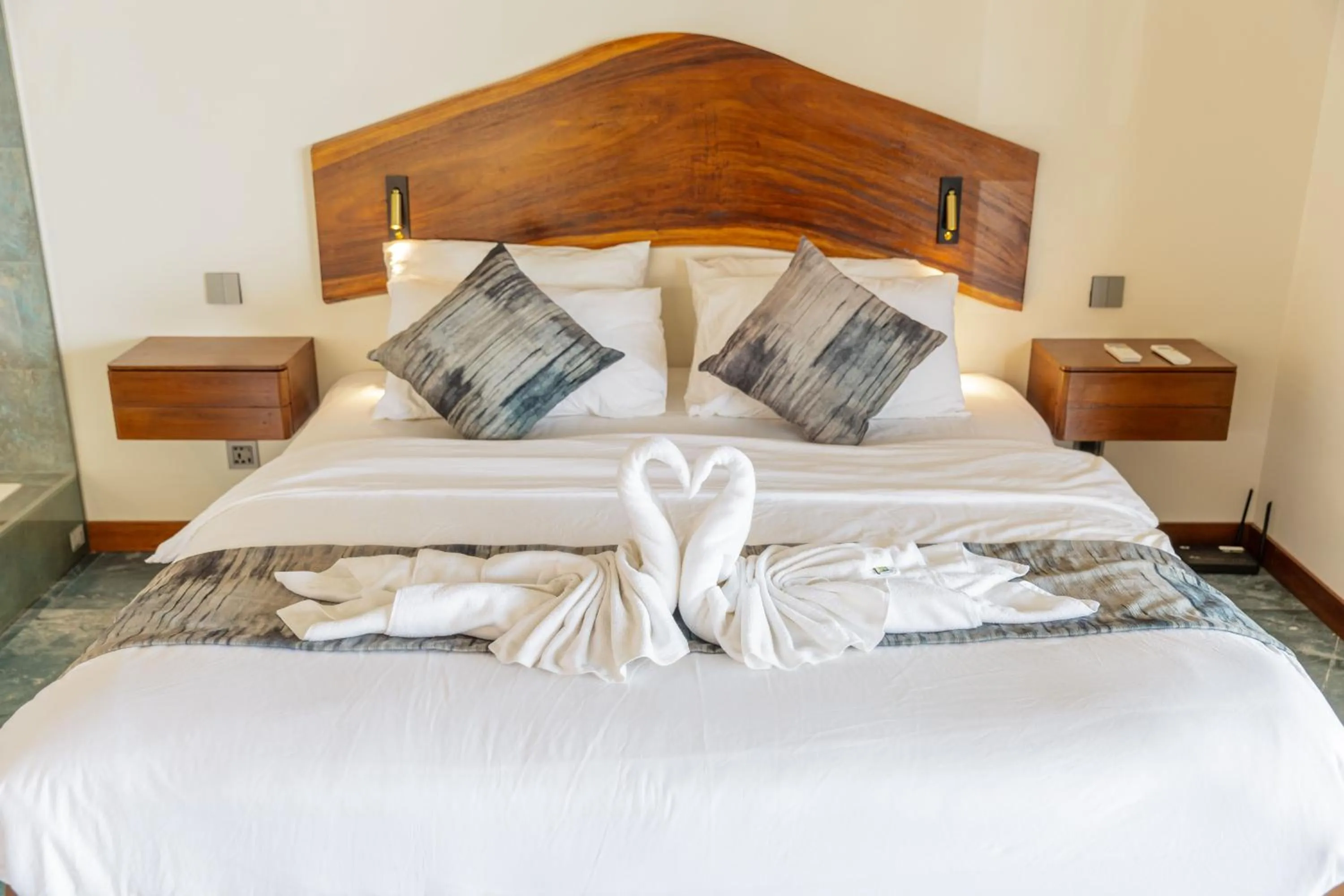 Bed in Absolute Beachfront Villas