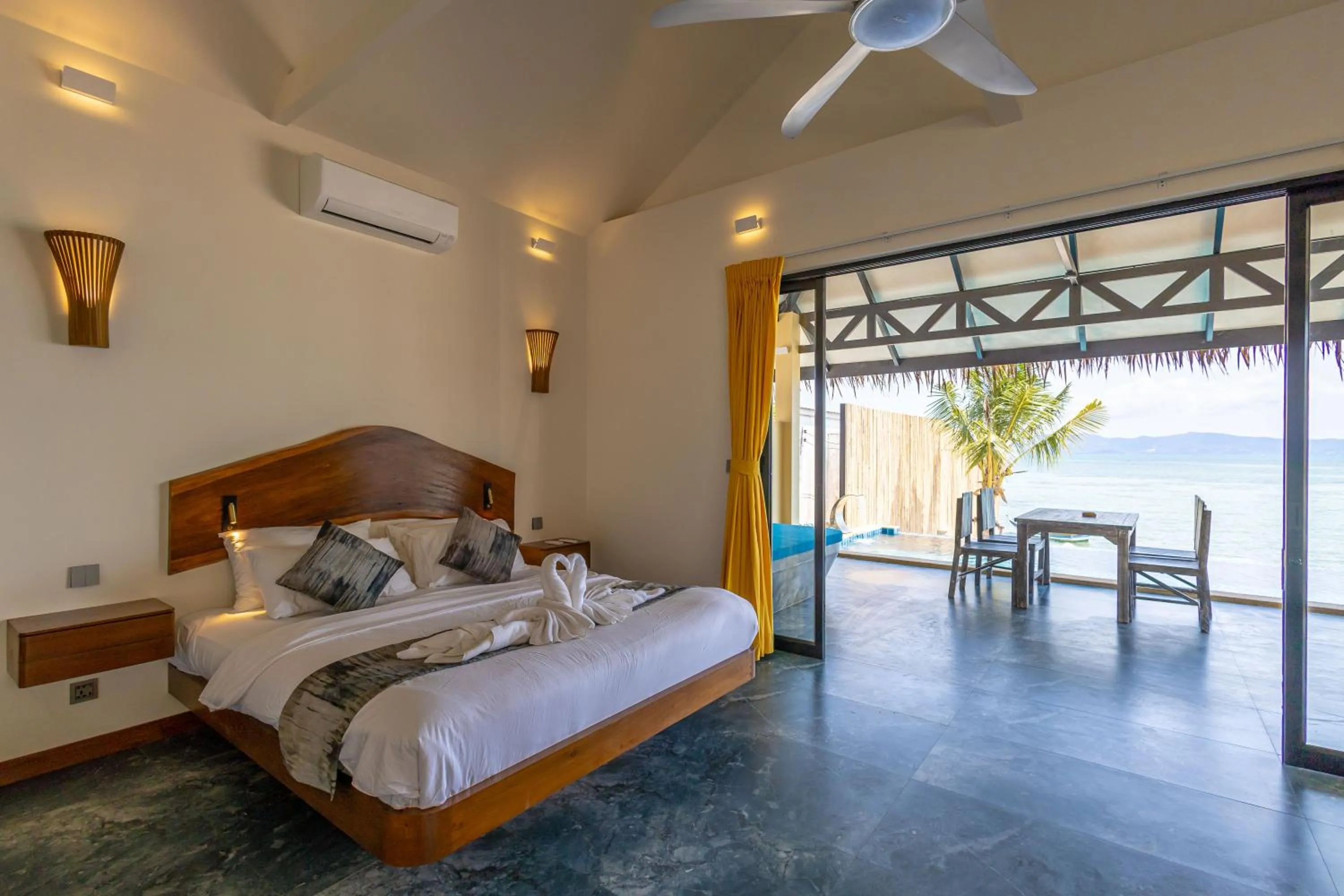 Bed in Absolute Beachfront Villas