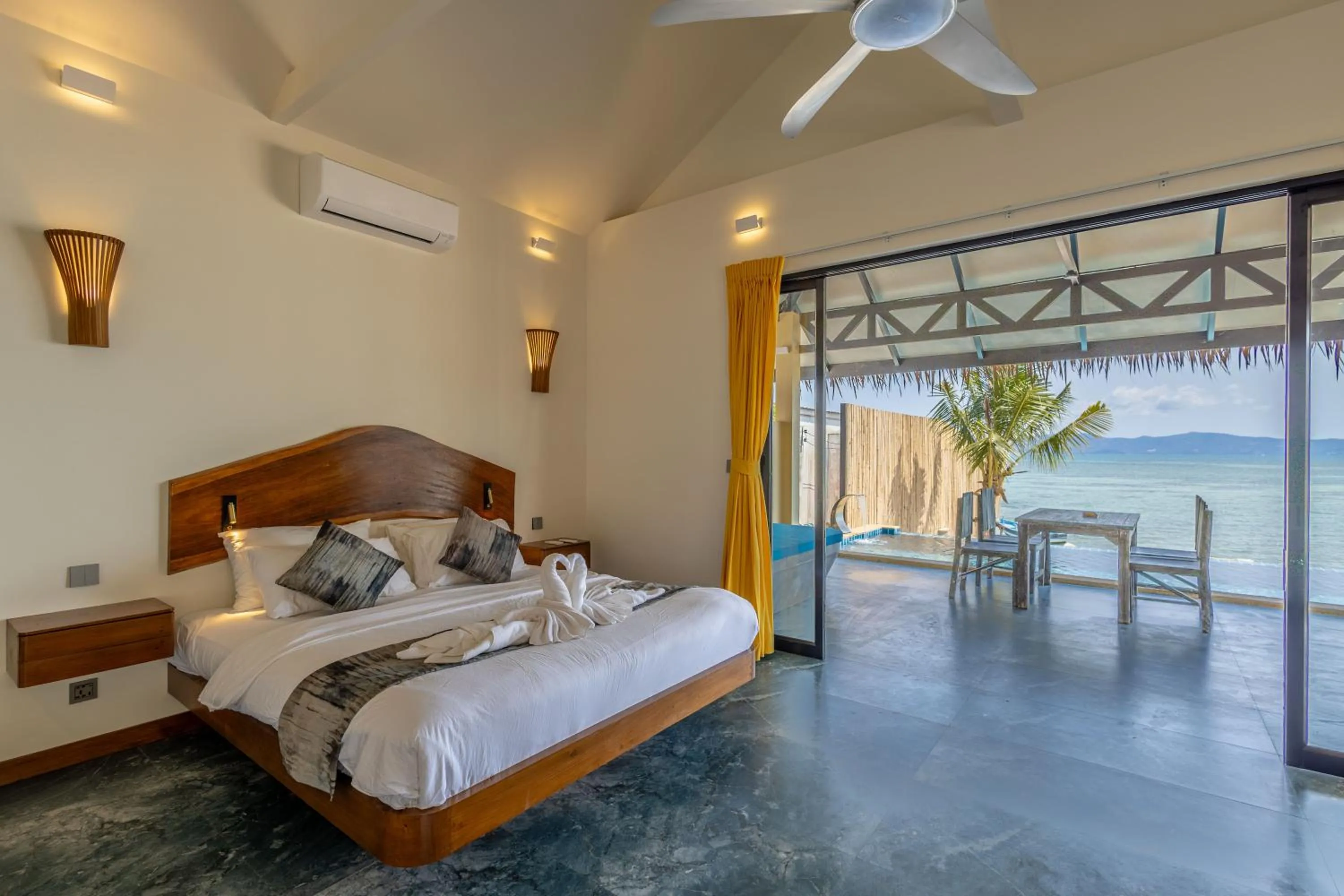 Bed in Absolute Beachfront Villas