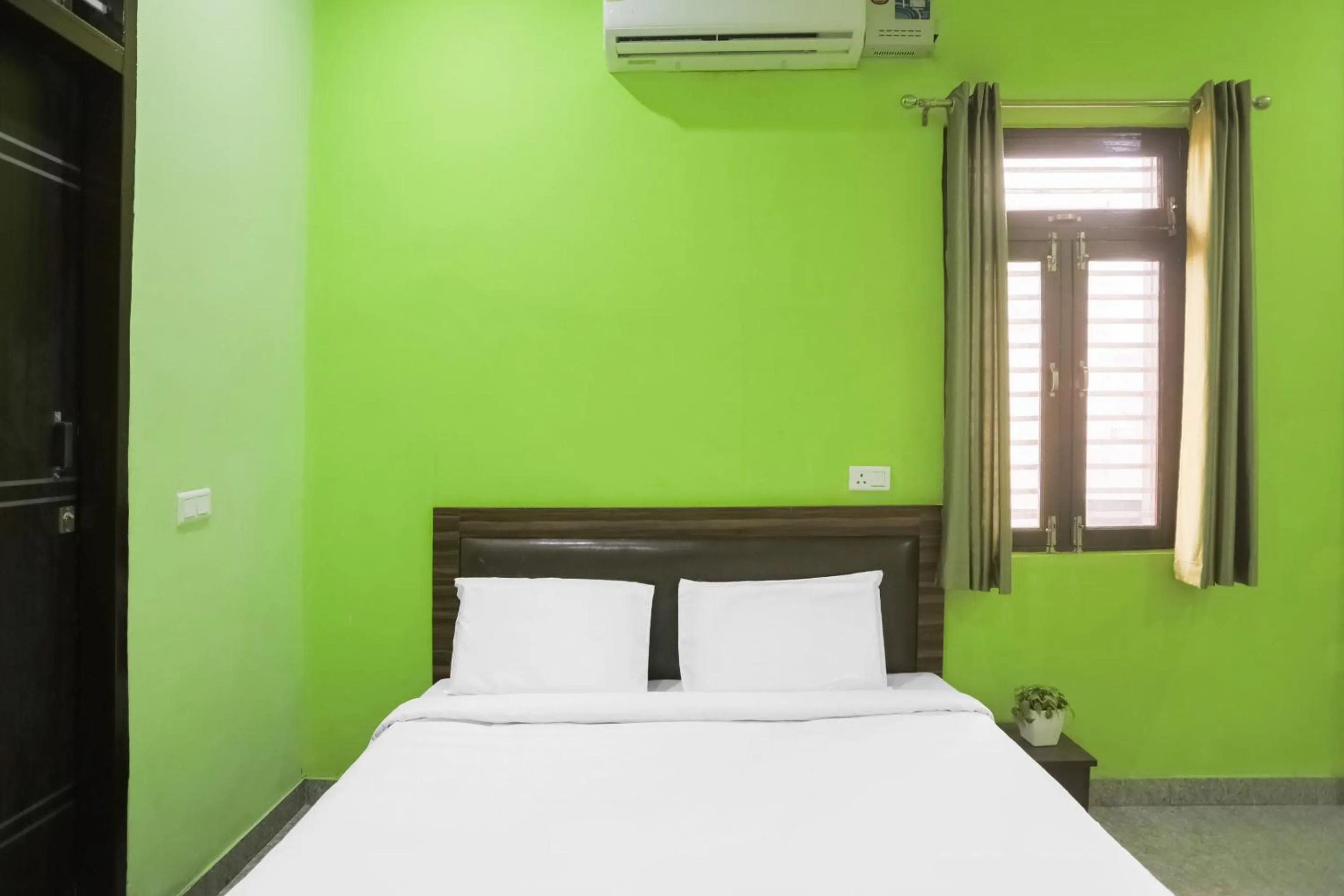 Bedroom in Capital O A-one