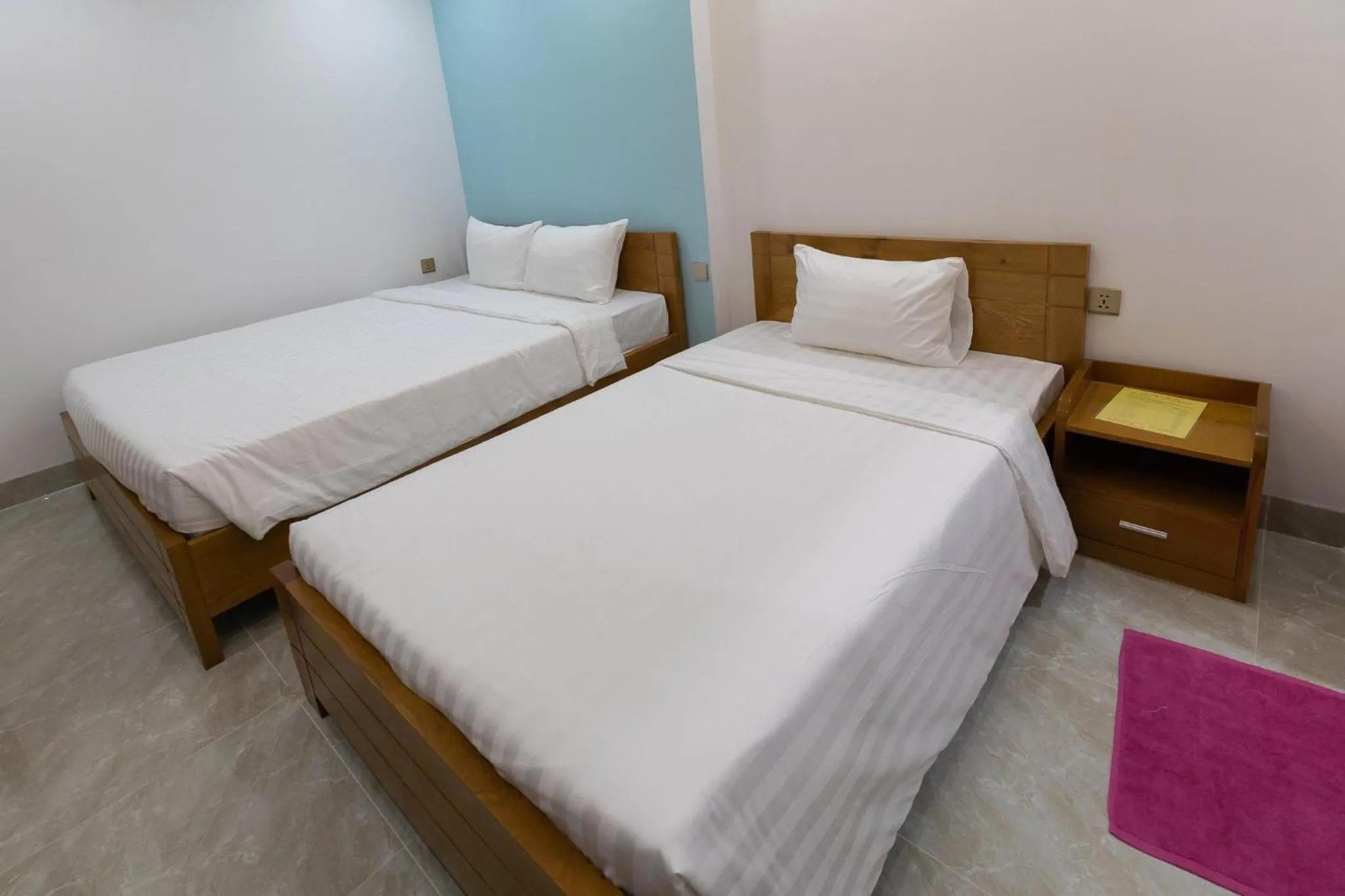 Bed in 26 Topaz Hotel