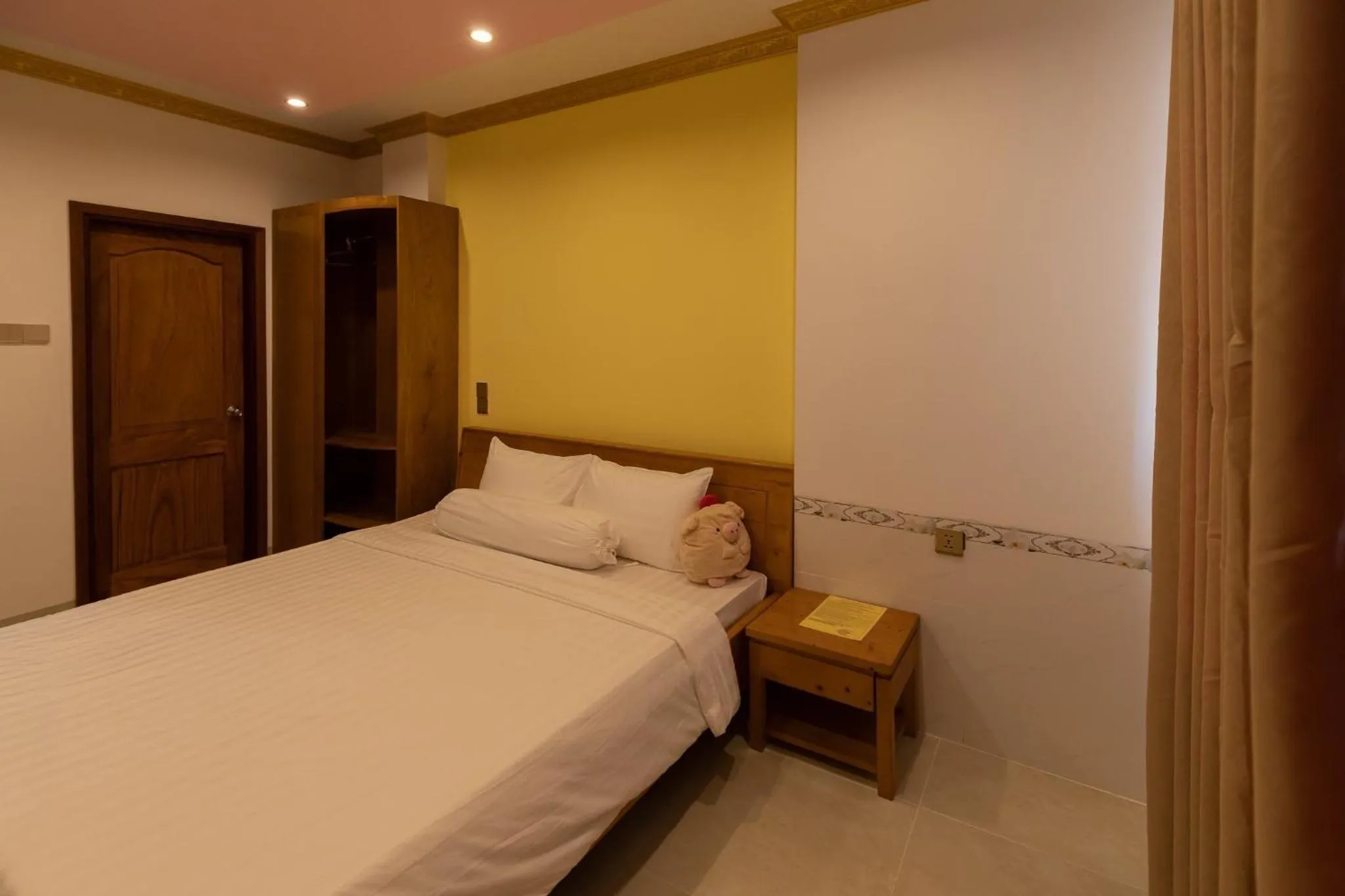 Bed in 26 Topaz Hotel