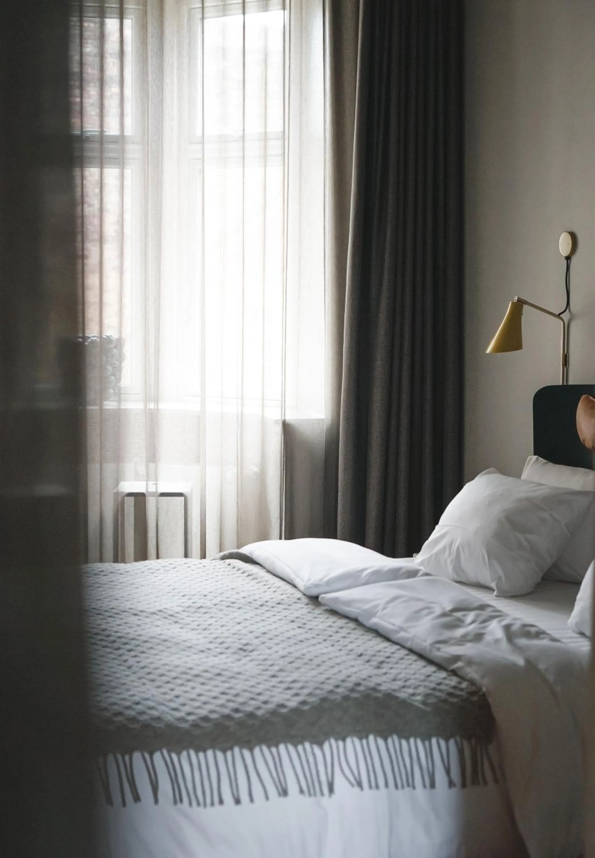 Bed in Apartments by Brøchner Hotels