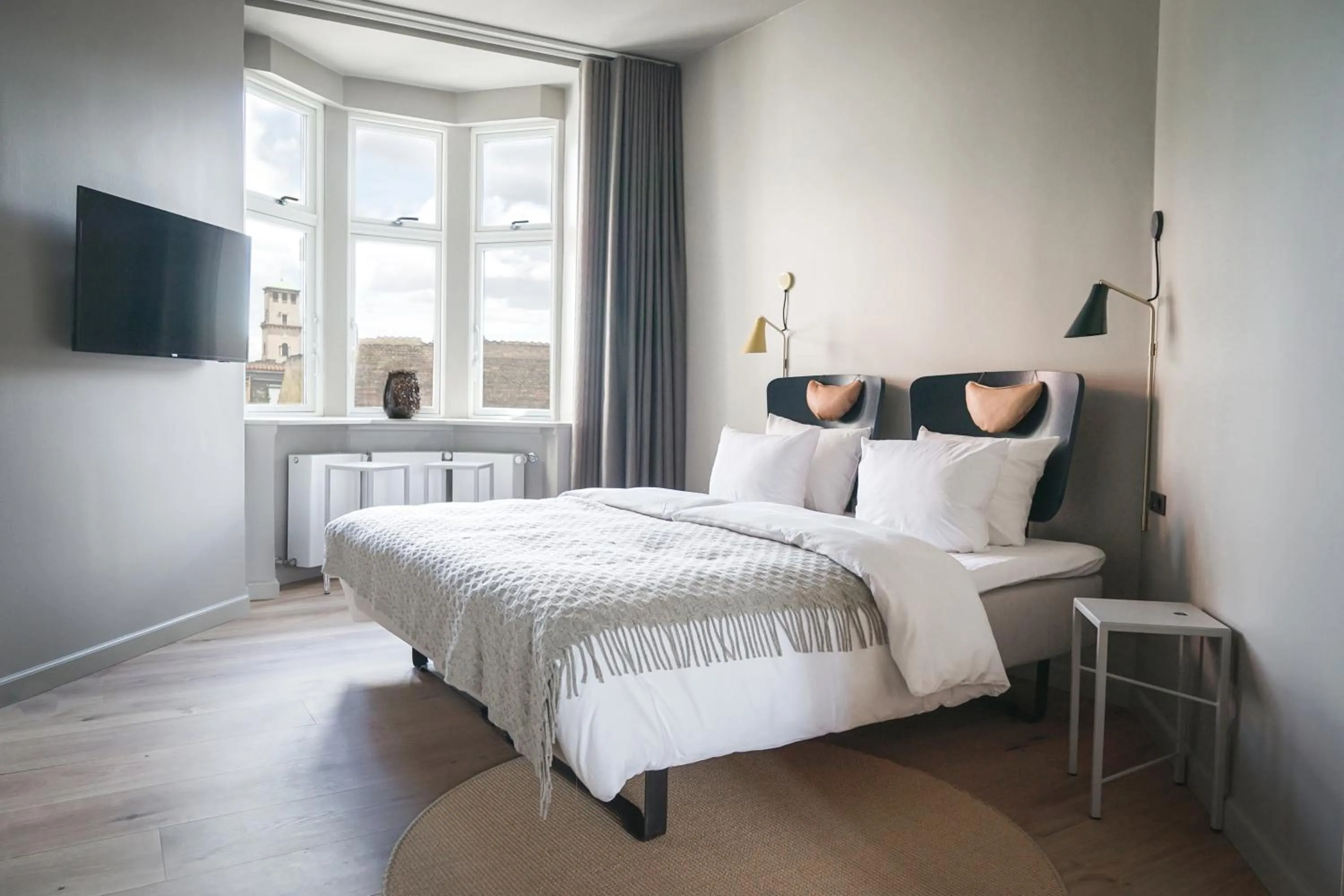 Bed in Apartments by Brøchner Hotels