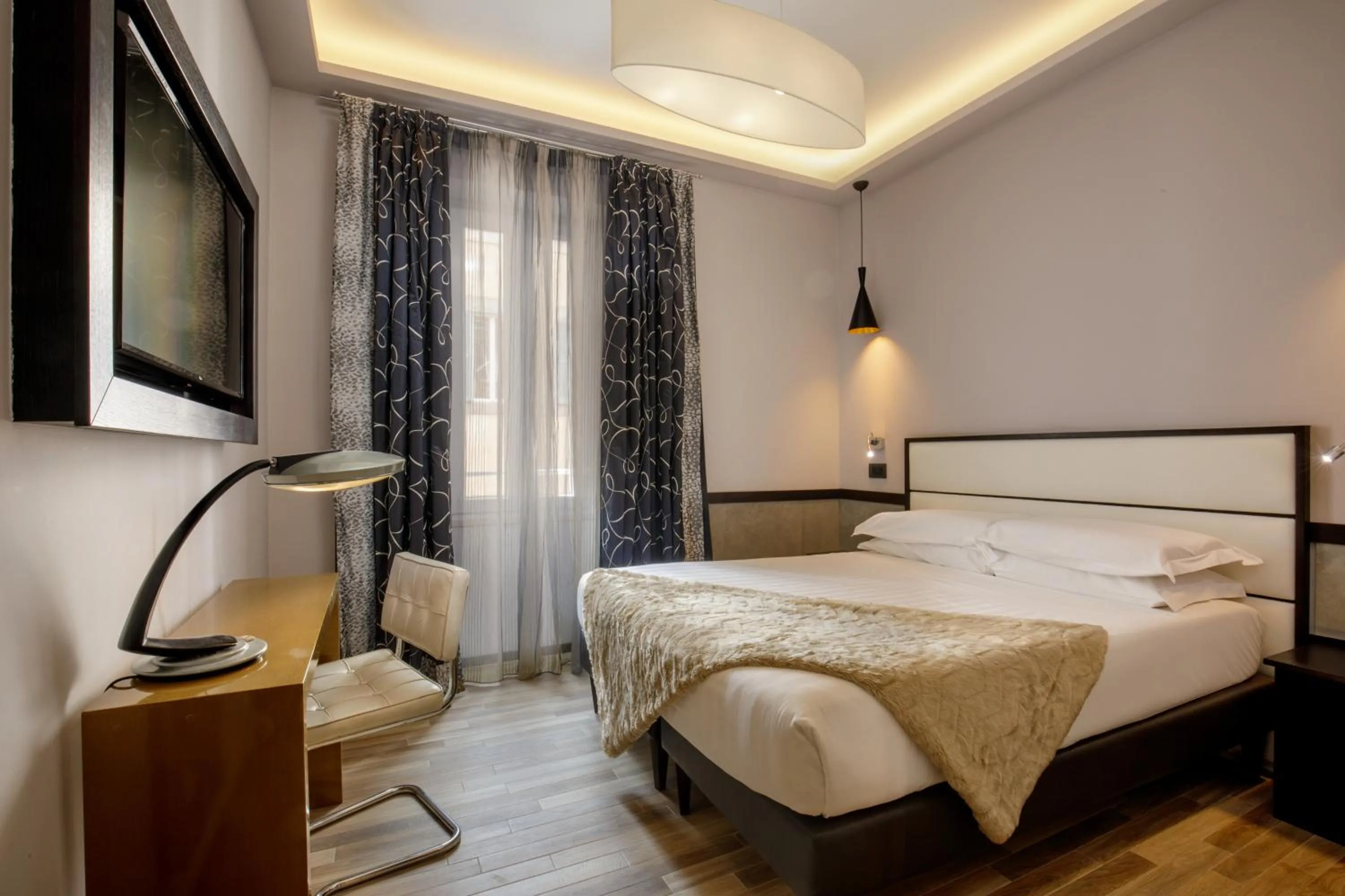 Bed in Flâneur Suites Corso