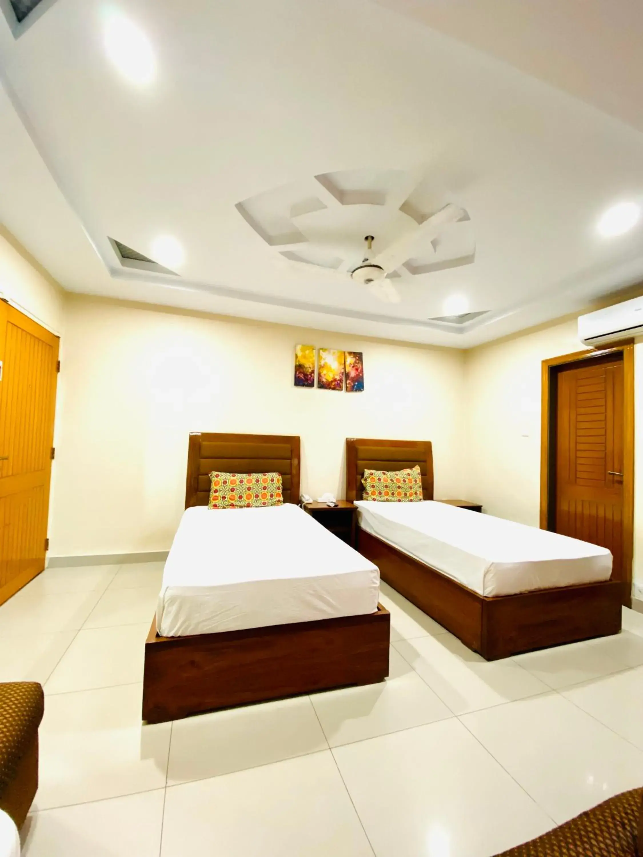 Standard Queen Room with Two Queen Beds in Plaza Inn Hotel Standard Queen Room with Two Queen Beds in Plaza Inn Hotel