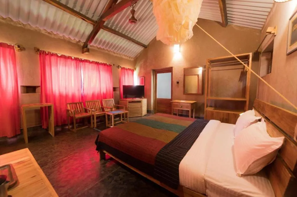 Communal lounge/ TV room, Bed in The Orchard Resort